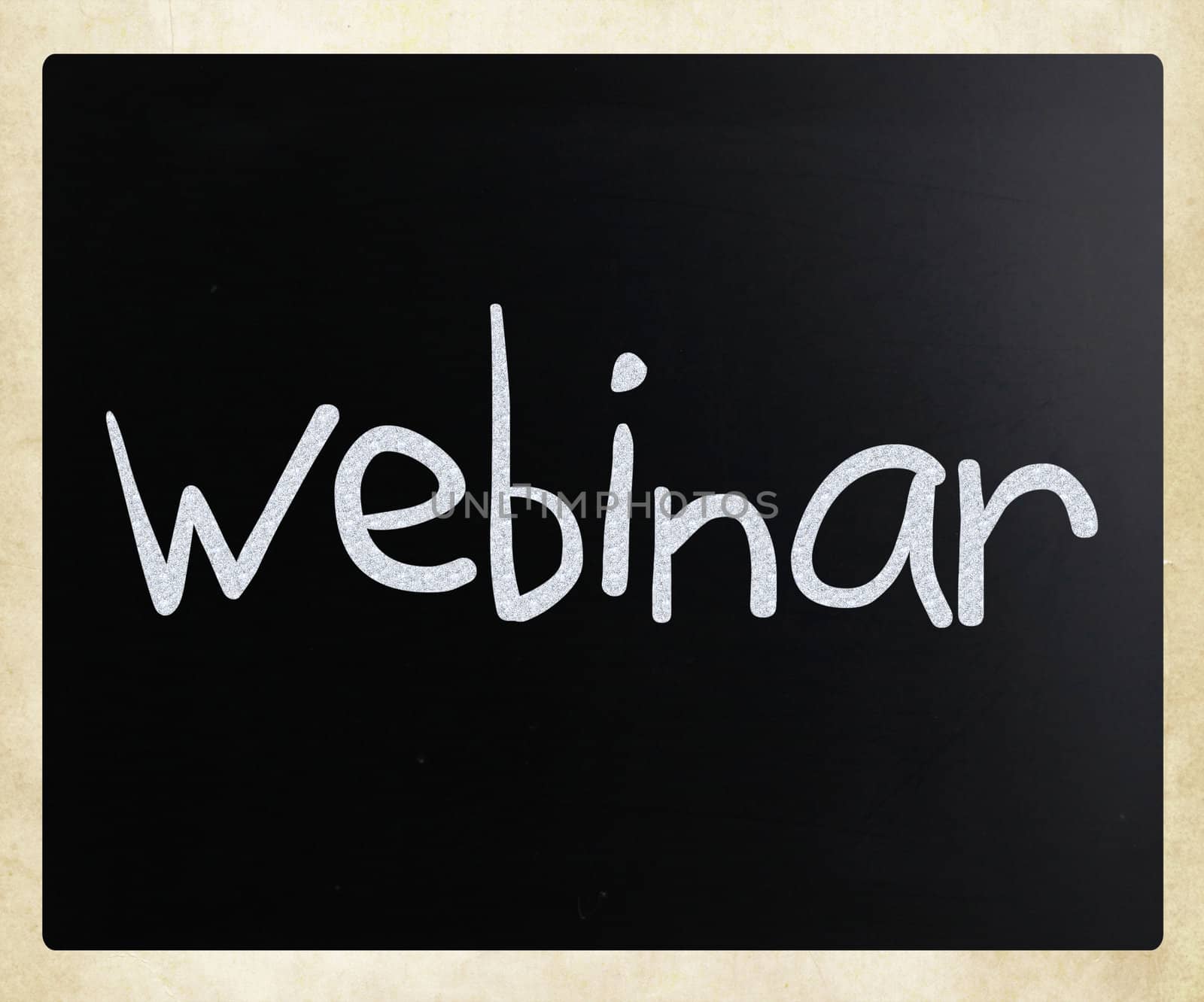 The word "Webinar" handwritten with white chalk on a blackboard