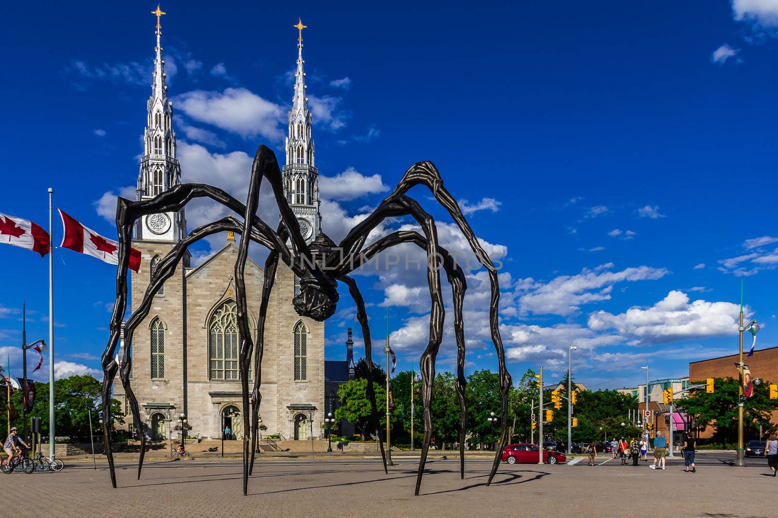 Maman spider sculpture on the Basilica church background, Ontario, Canada