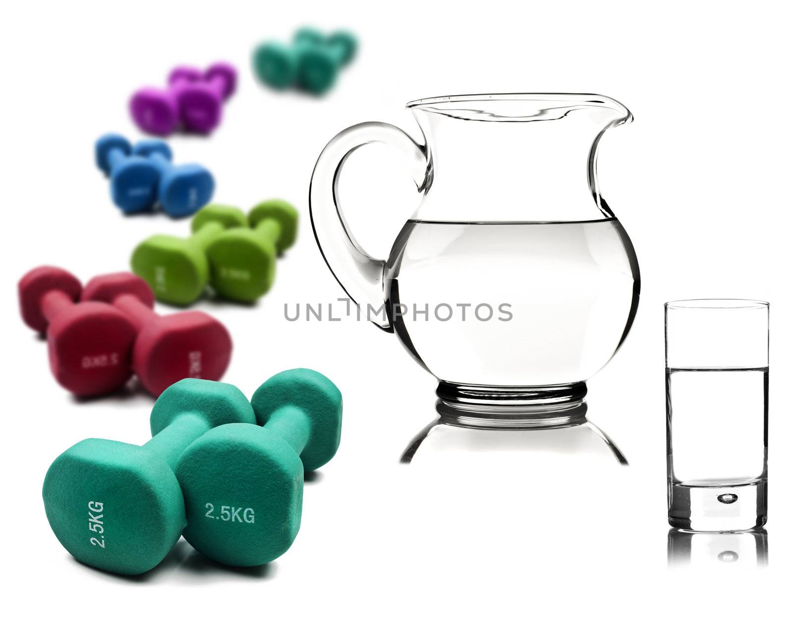 Healthy lifestyle - water in a pitcher and glass with dumbbells by tish1