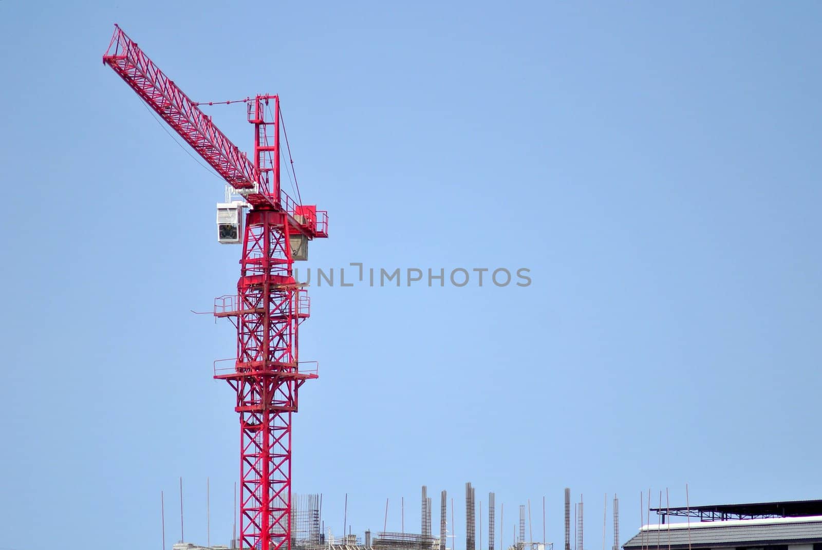 Red crane tower with sky background