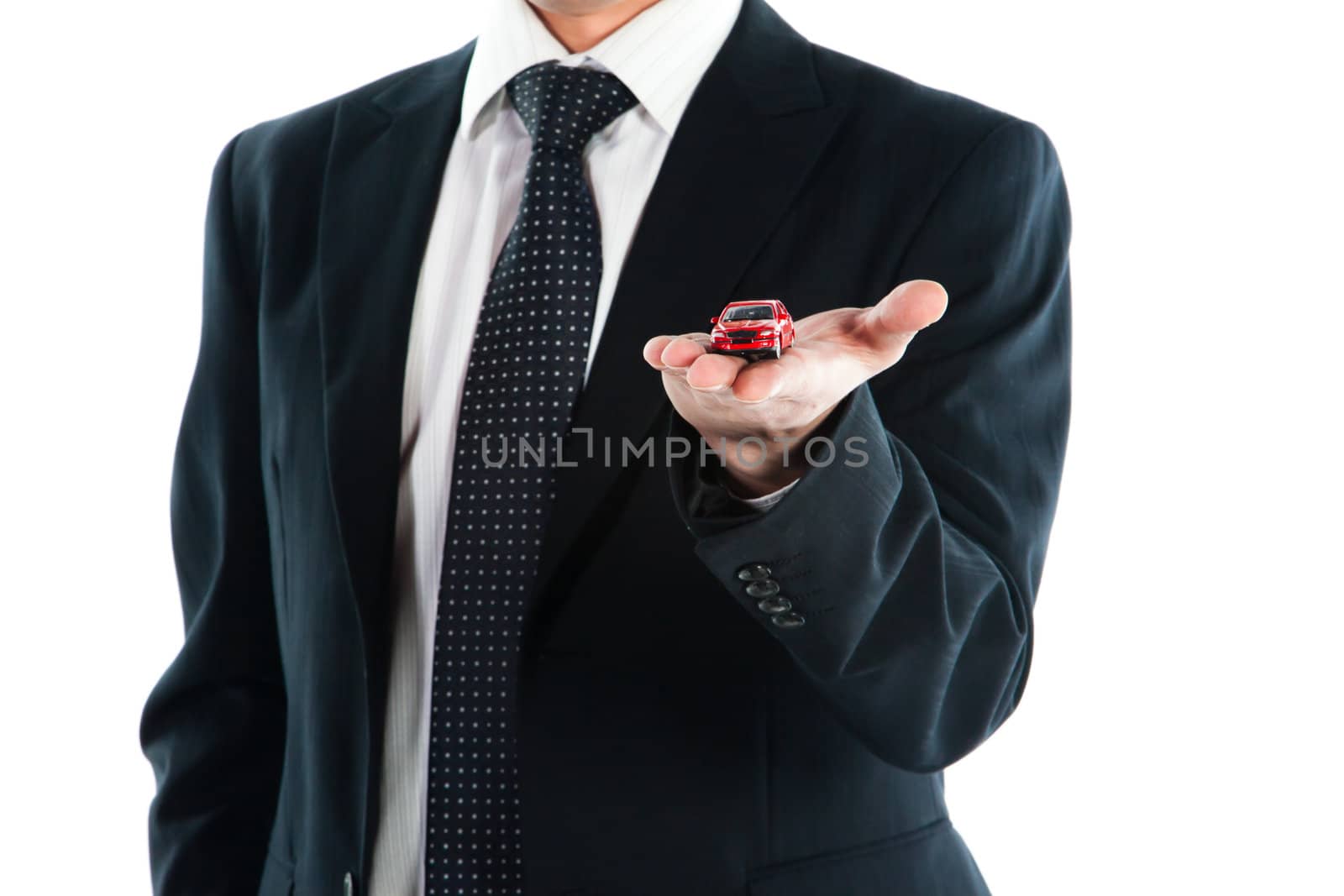 portrait of a young manager for motor with a small red toy car