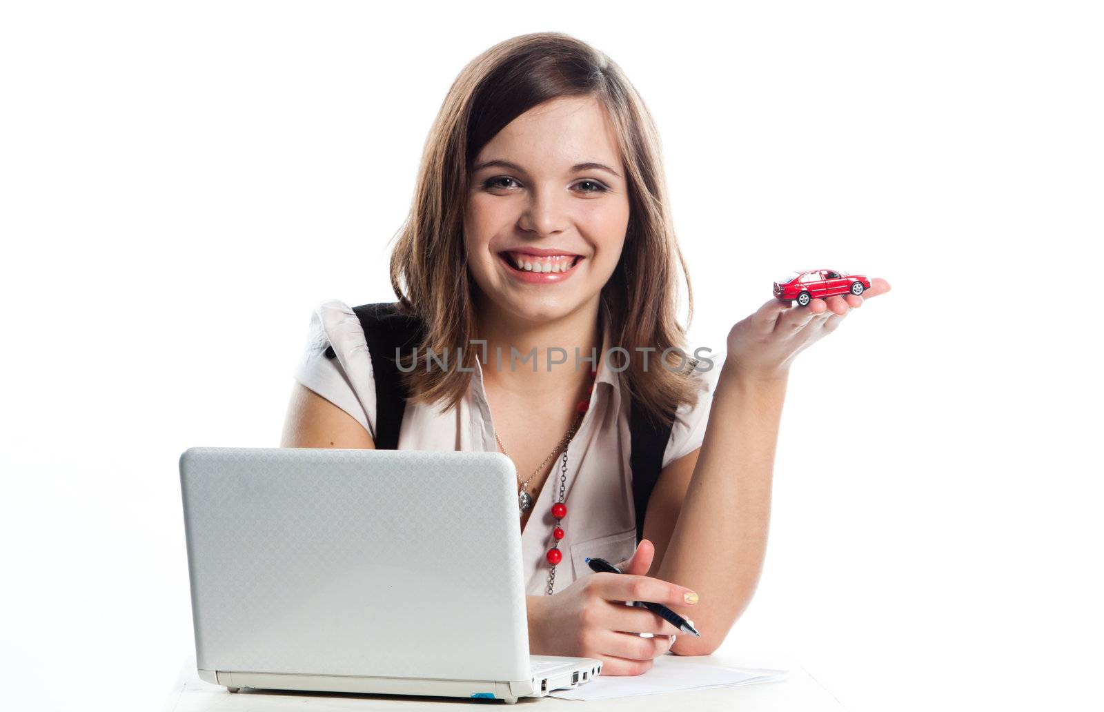 portrait of a young manager for motor with a small red toy car