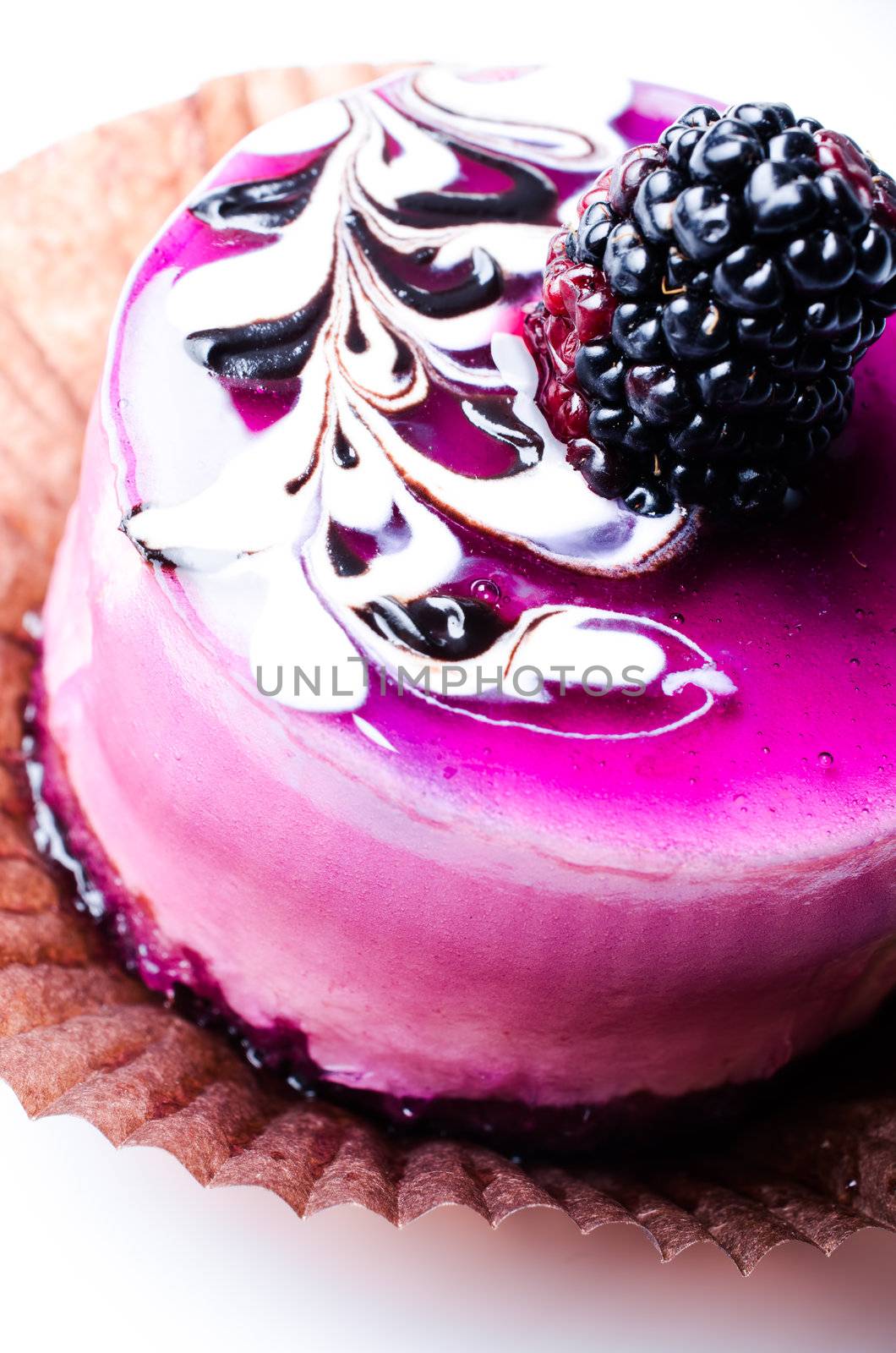 Cake with blackberry on white