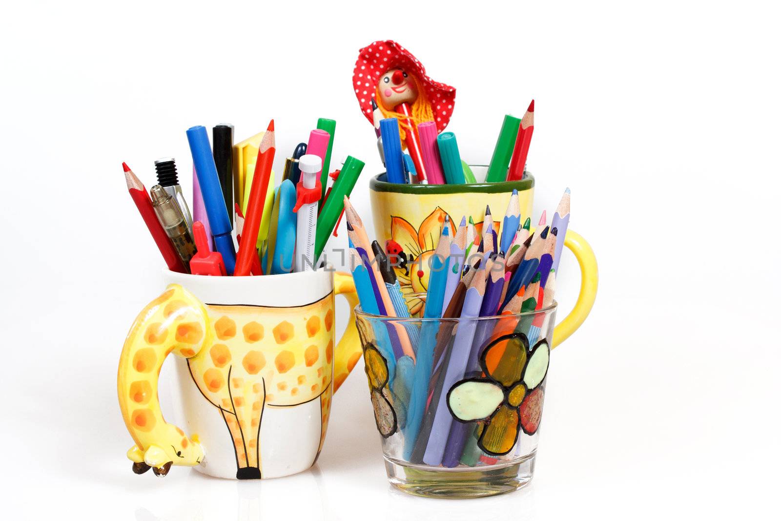 pen holders full of brightly colored pens on a white background 