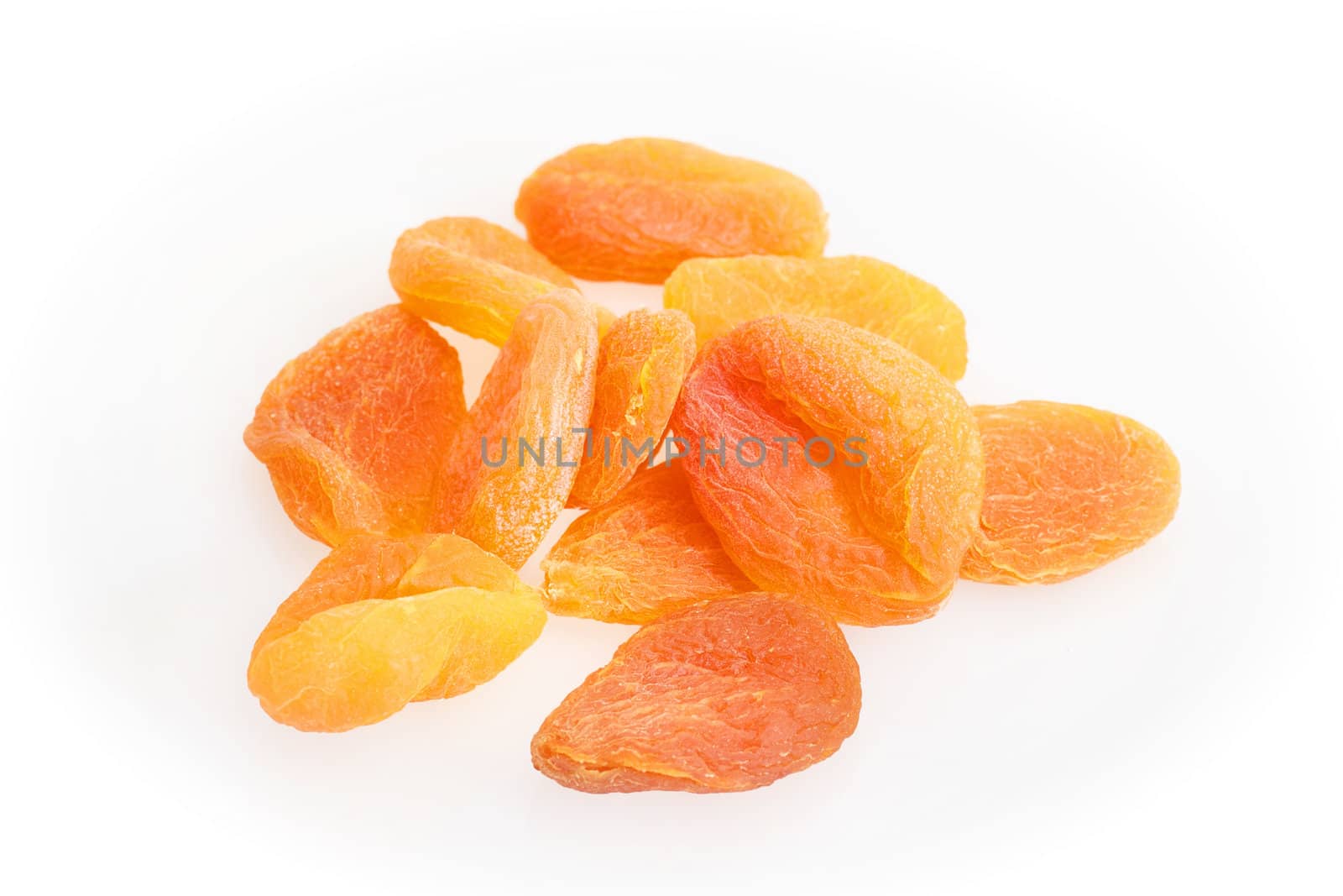 group of dried apricots isolated on a white background