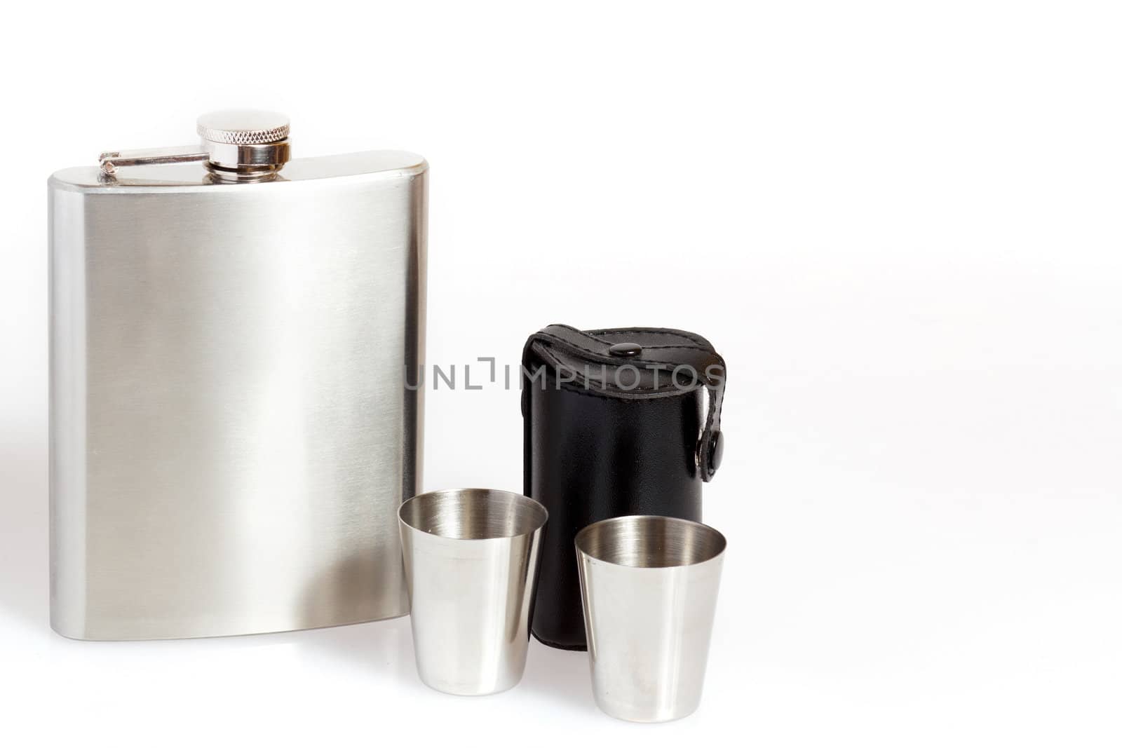 Hip flask and cups on white background