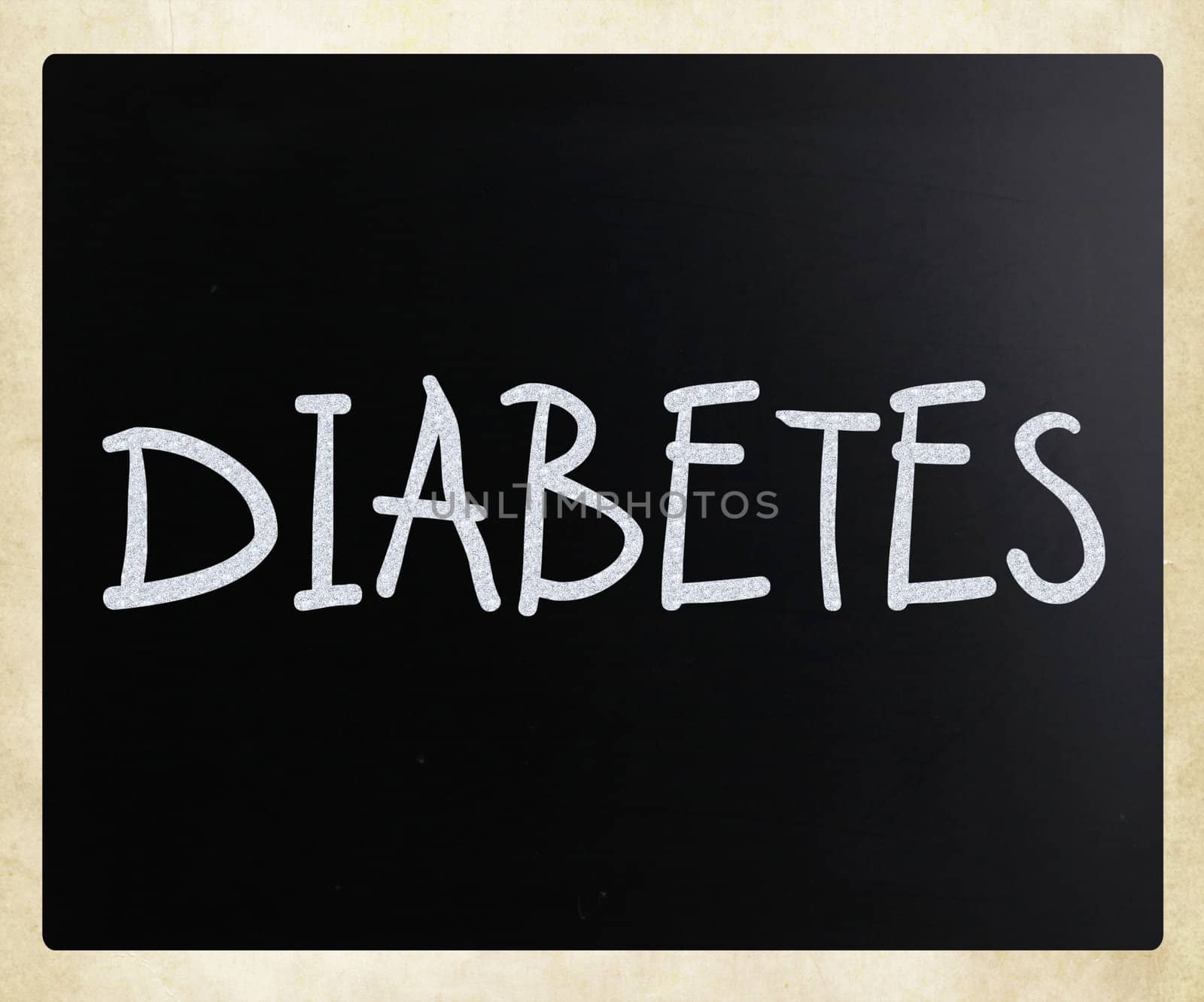 "Diabetes" handwritten with white chalk on a blackboard