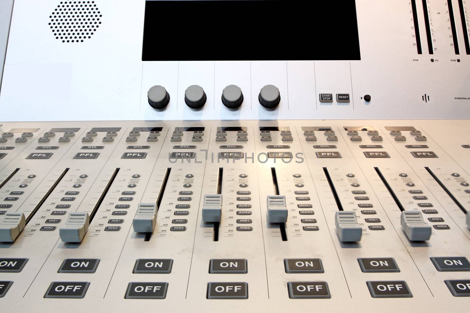 Part of an audio sound mixer with buttons 