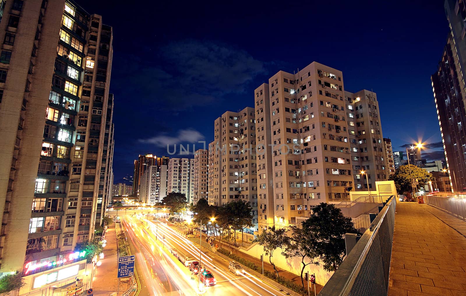 modern urban city at night with freeway traffic