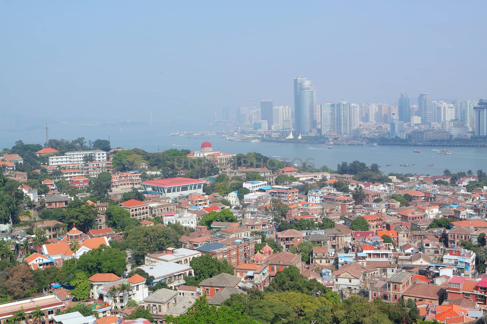Aerial image of a modern city by a river 