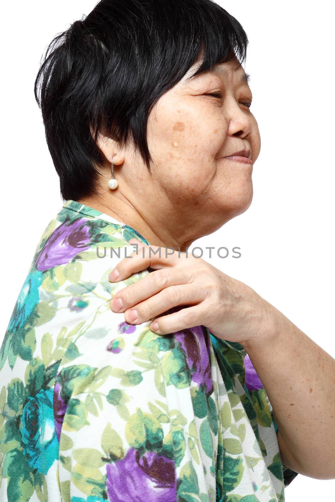 senior woman holding her aching back , massage herself