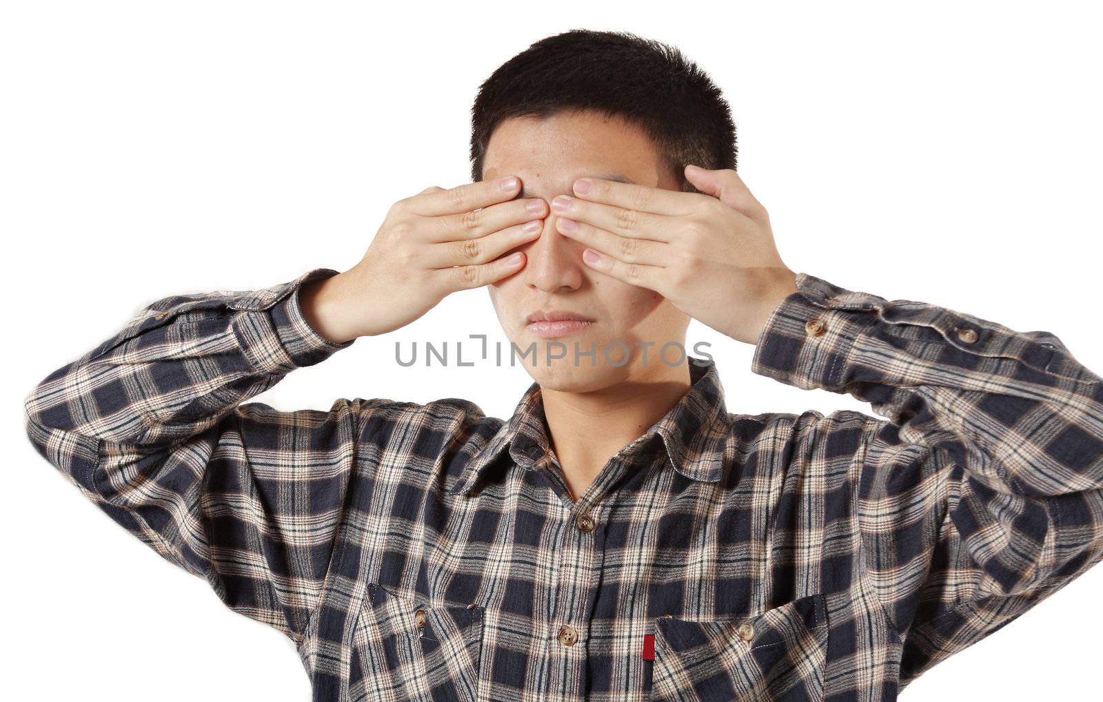 Portrait of a young man covering his eyes with hands  by cozyta