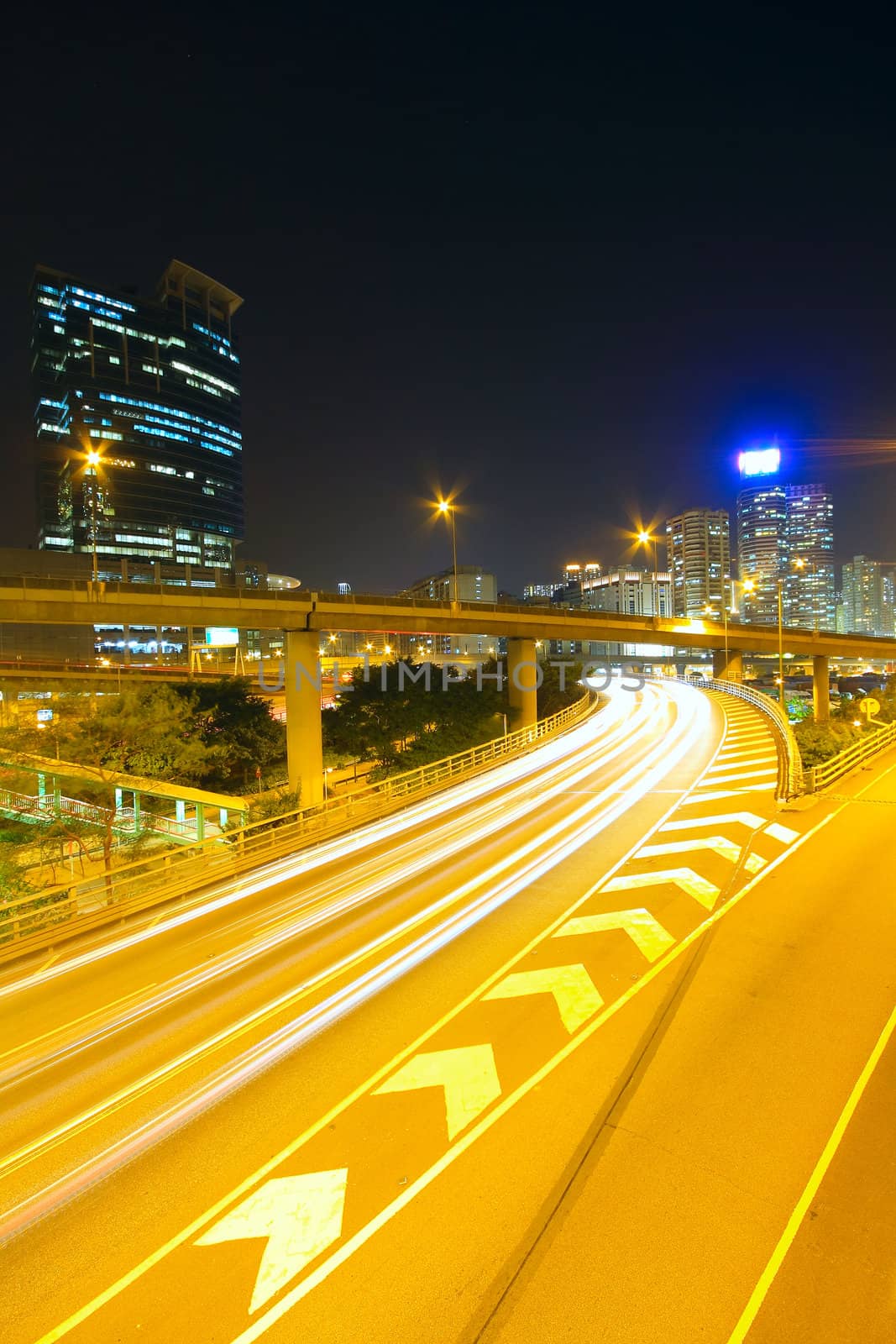 Traffic at night with traces of lights left by the cars on a highway 