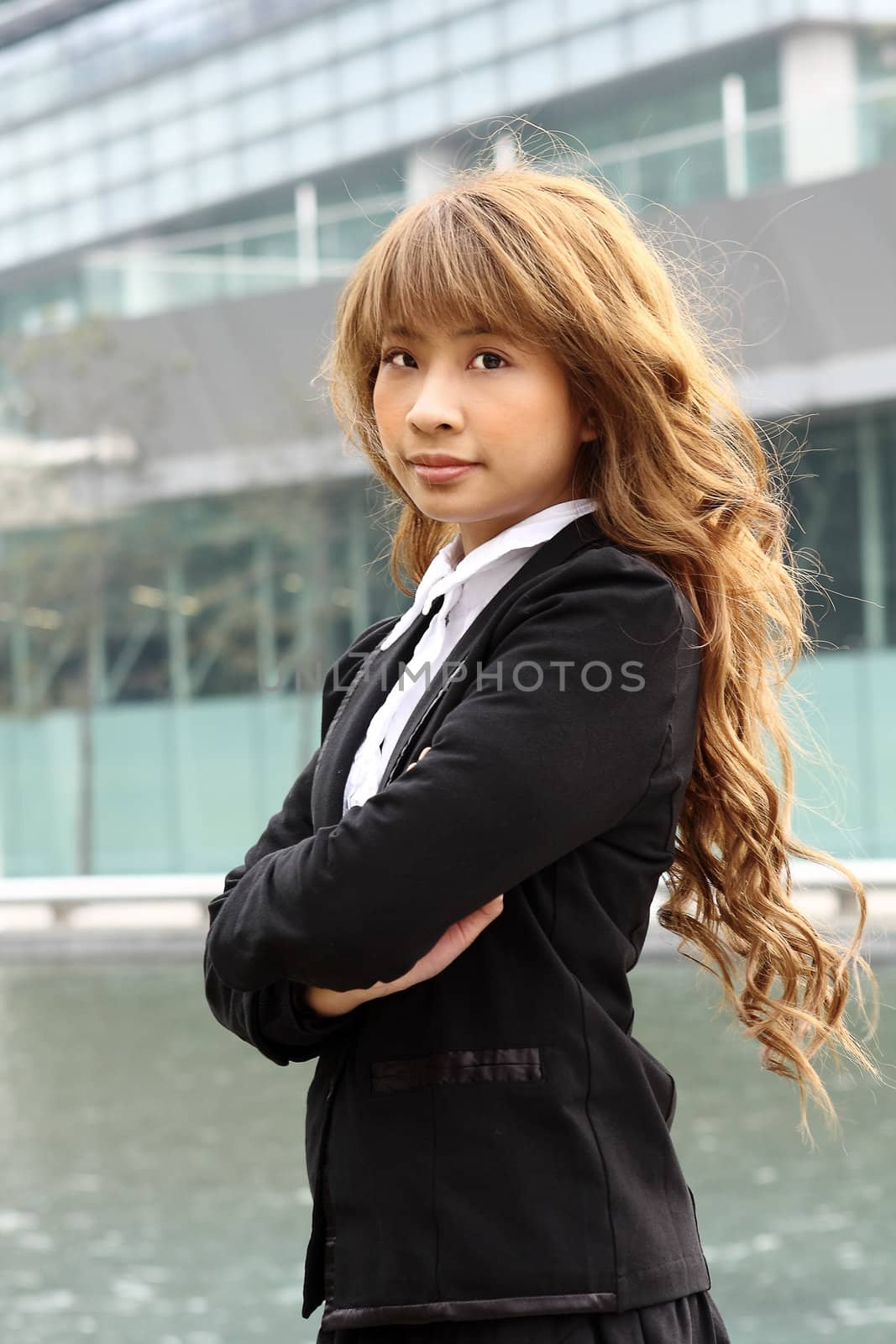 young business woman and an office background