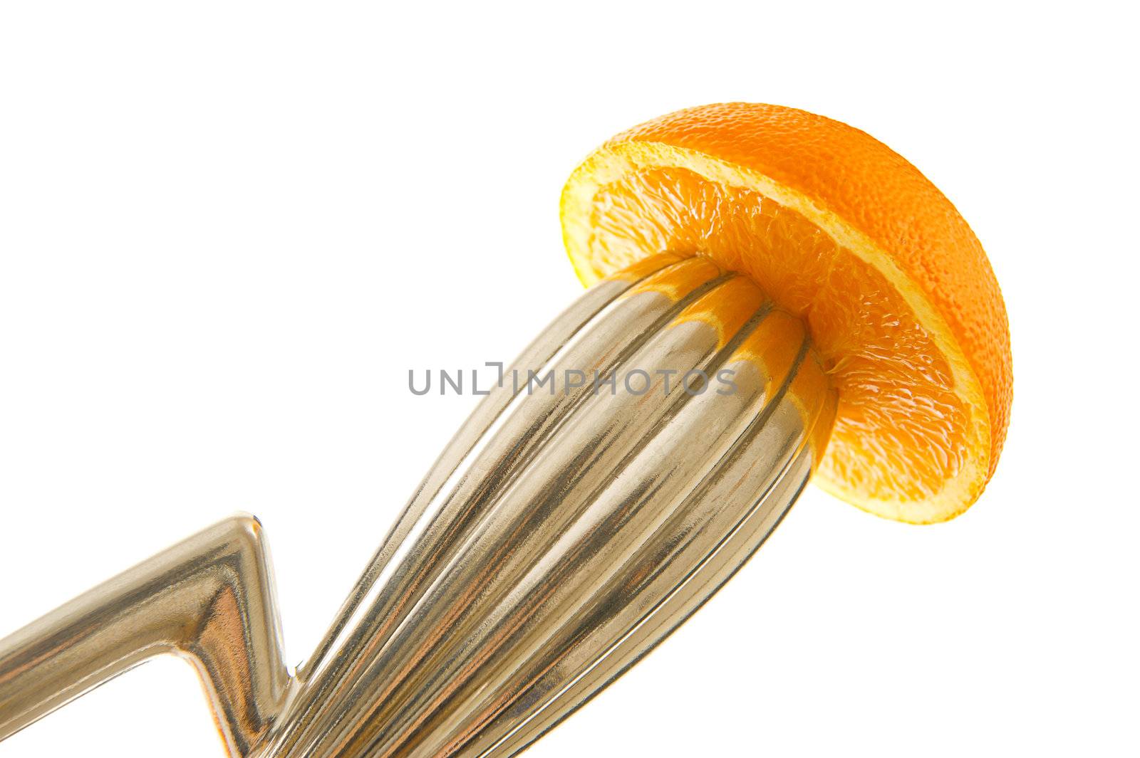 Squeezed orange on juicer. Healthy drink