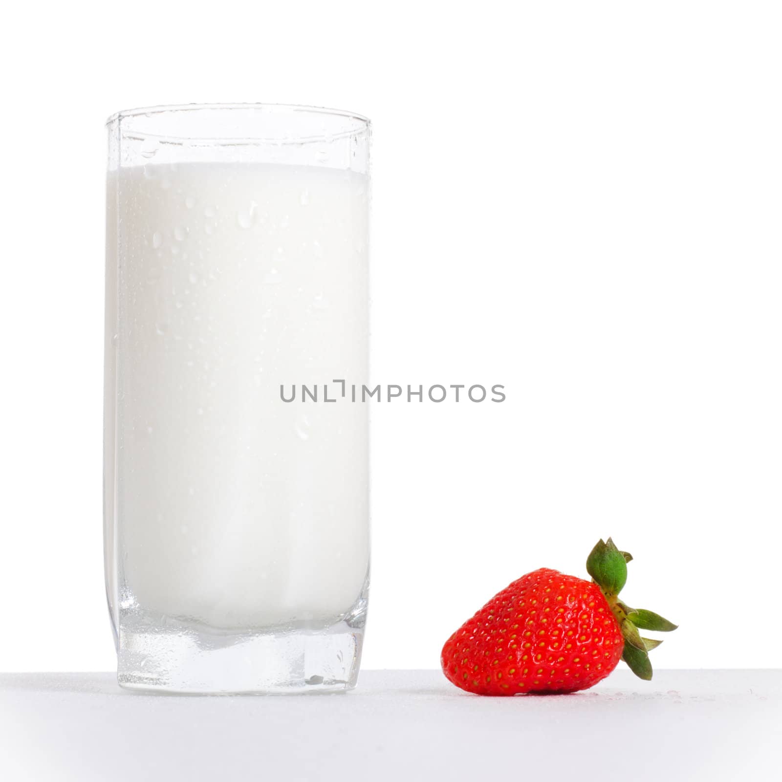 glass of milk and strawberry by petr_malyshev