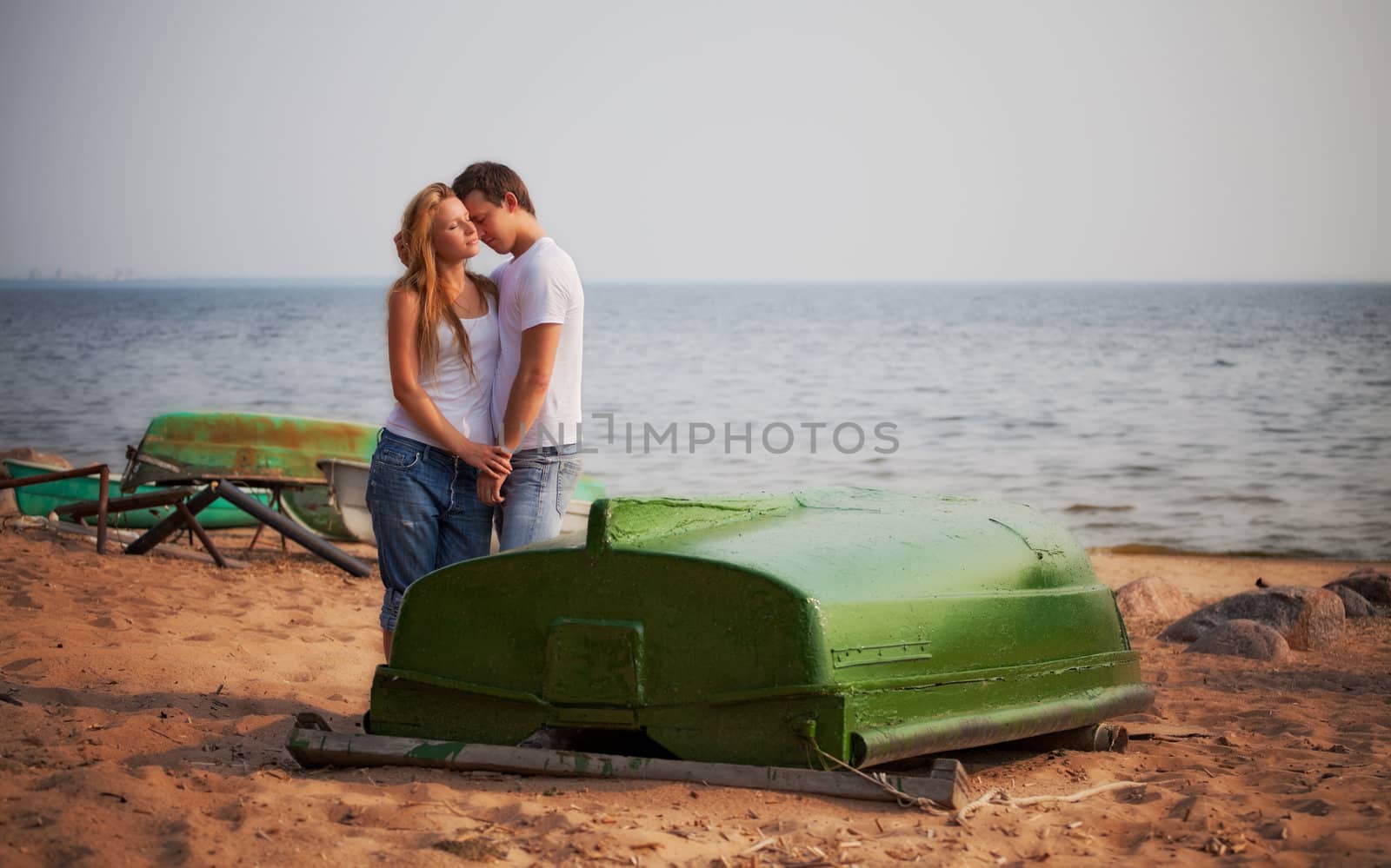 beautiful couple embrace on a beach