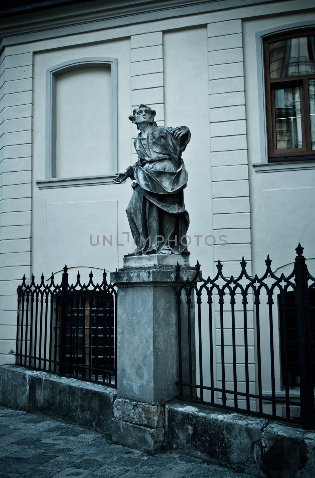 statue with book near Latin Cathedral, Lviv