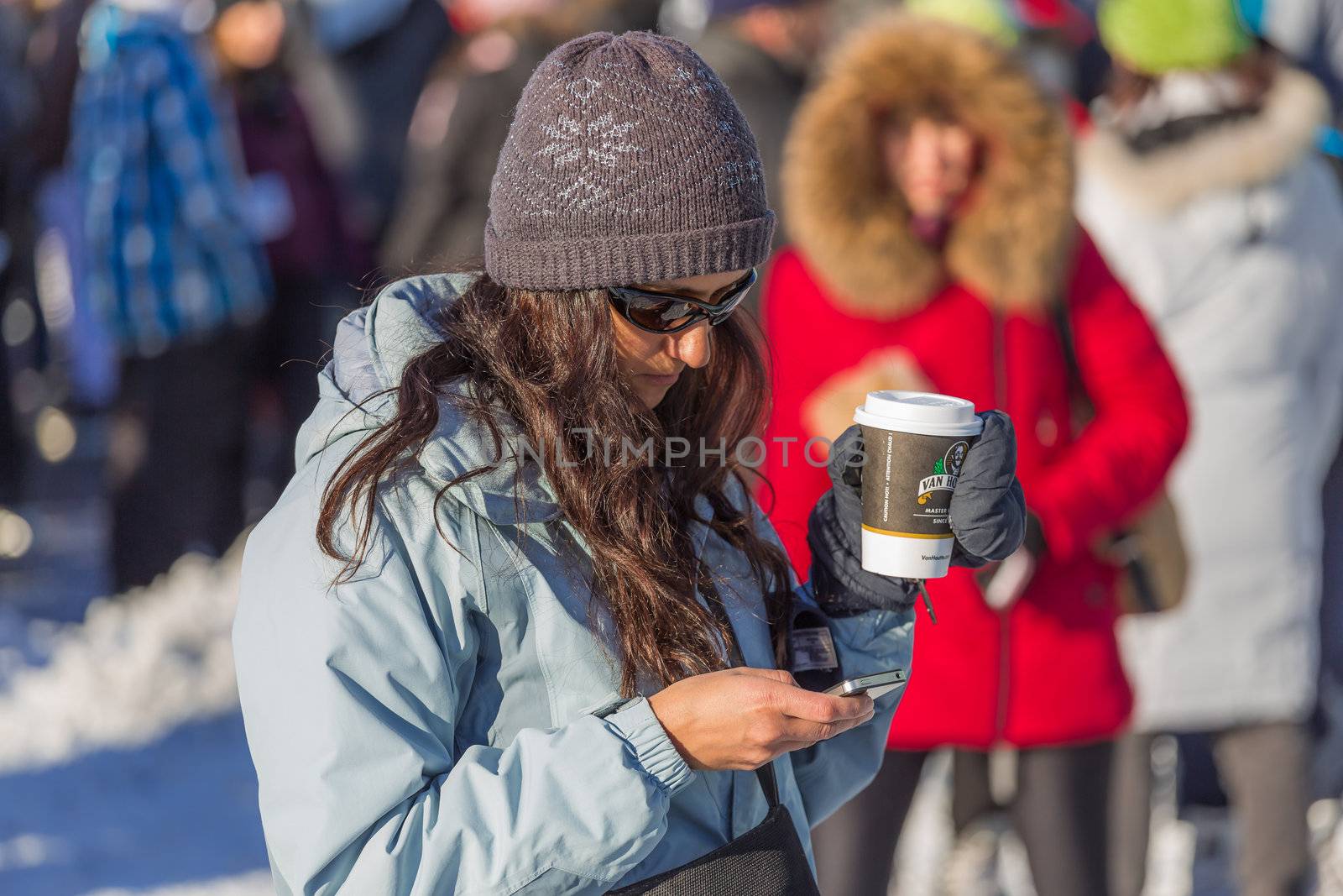 A woman on her phone by petkolophoto