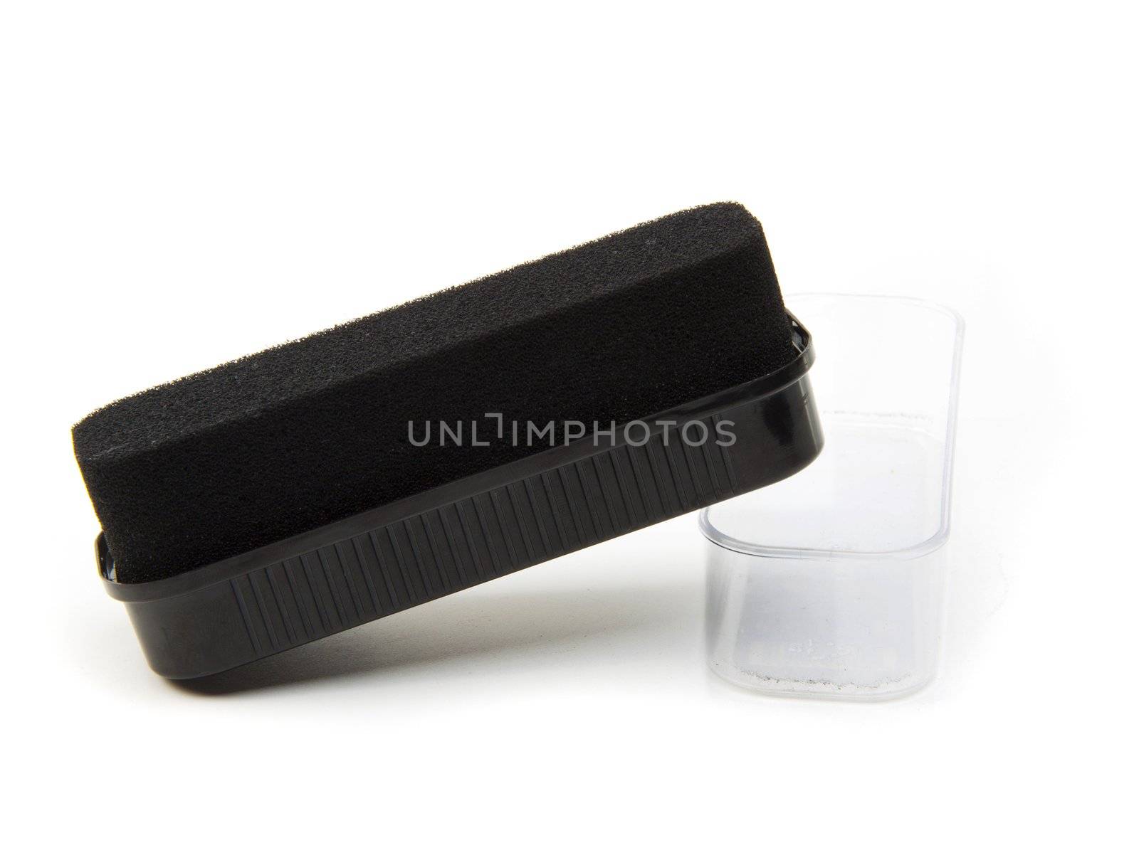 Black sponge for care of footwear, it is isolated on the white