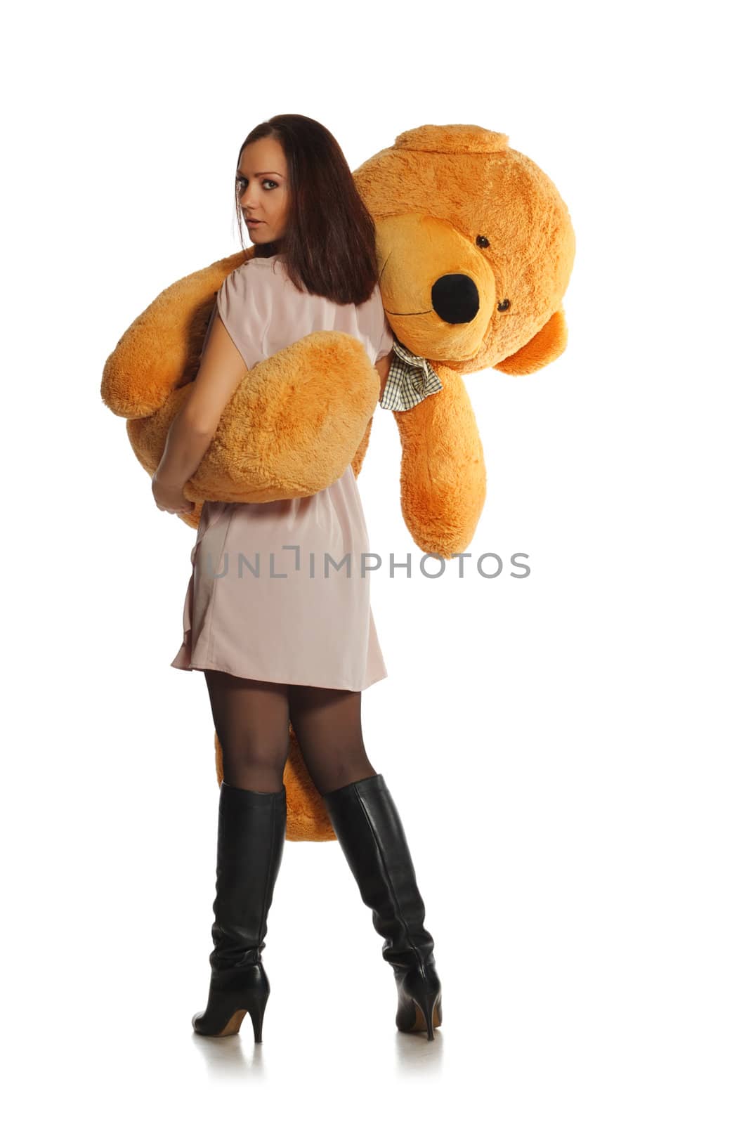 beautiful girl with toy bear isolated on white