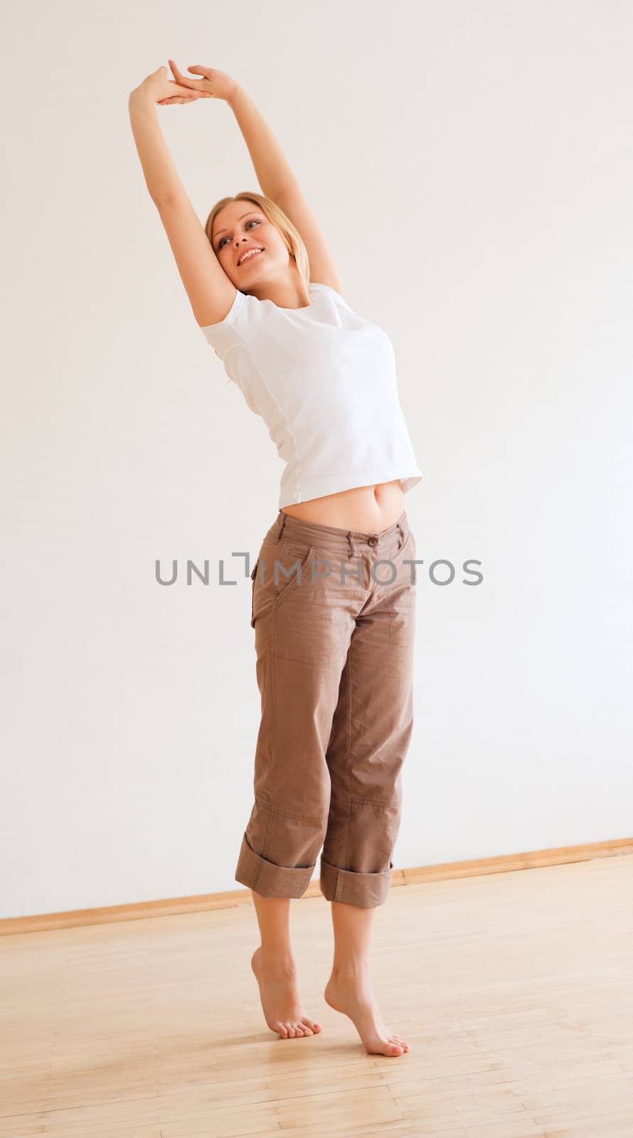 cute young girl walking and stretches at home