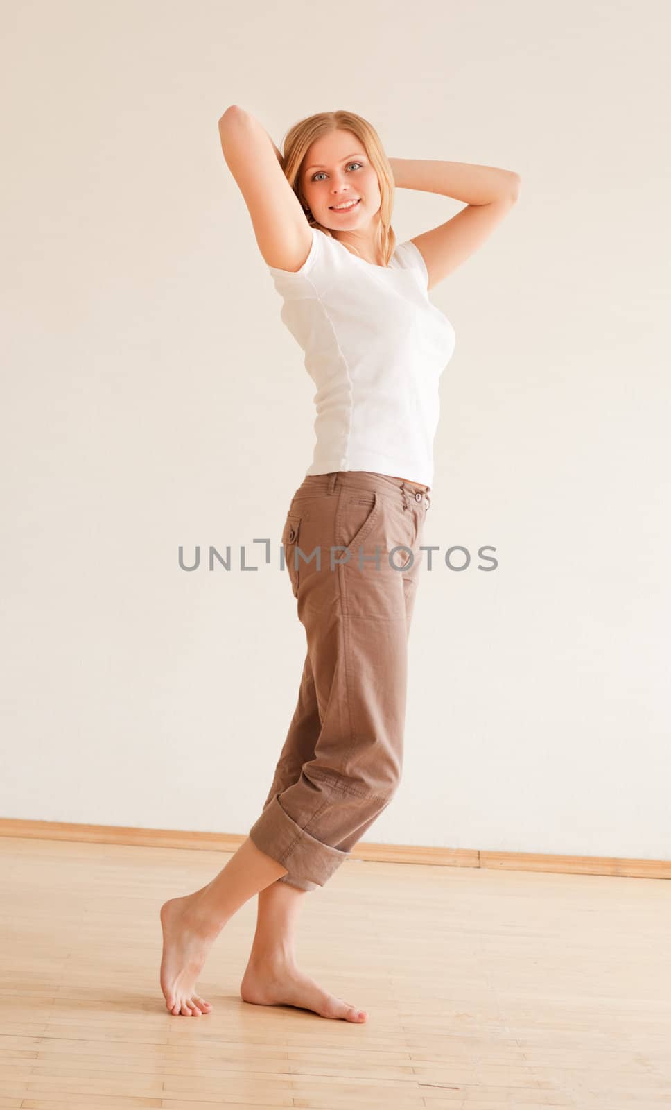cute young girl walking and stretches at home