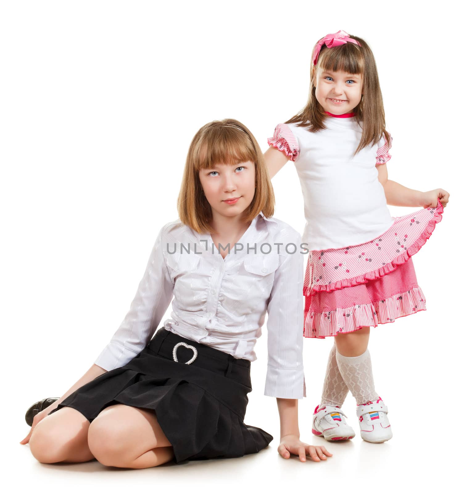 cute little sisters portrait, close up, isolated on white