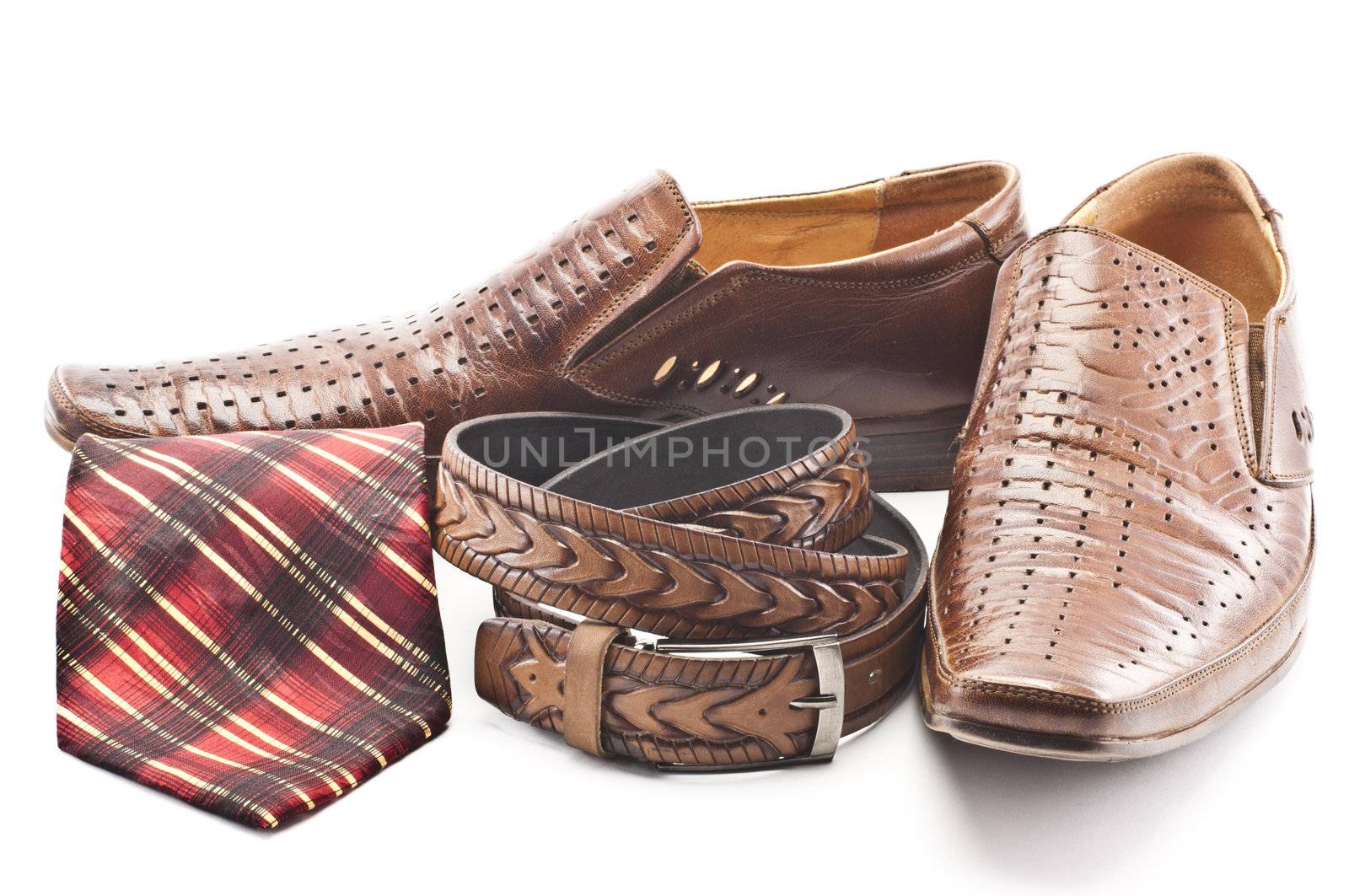 Men's shoes, tie and men's belt on a white background