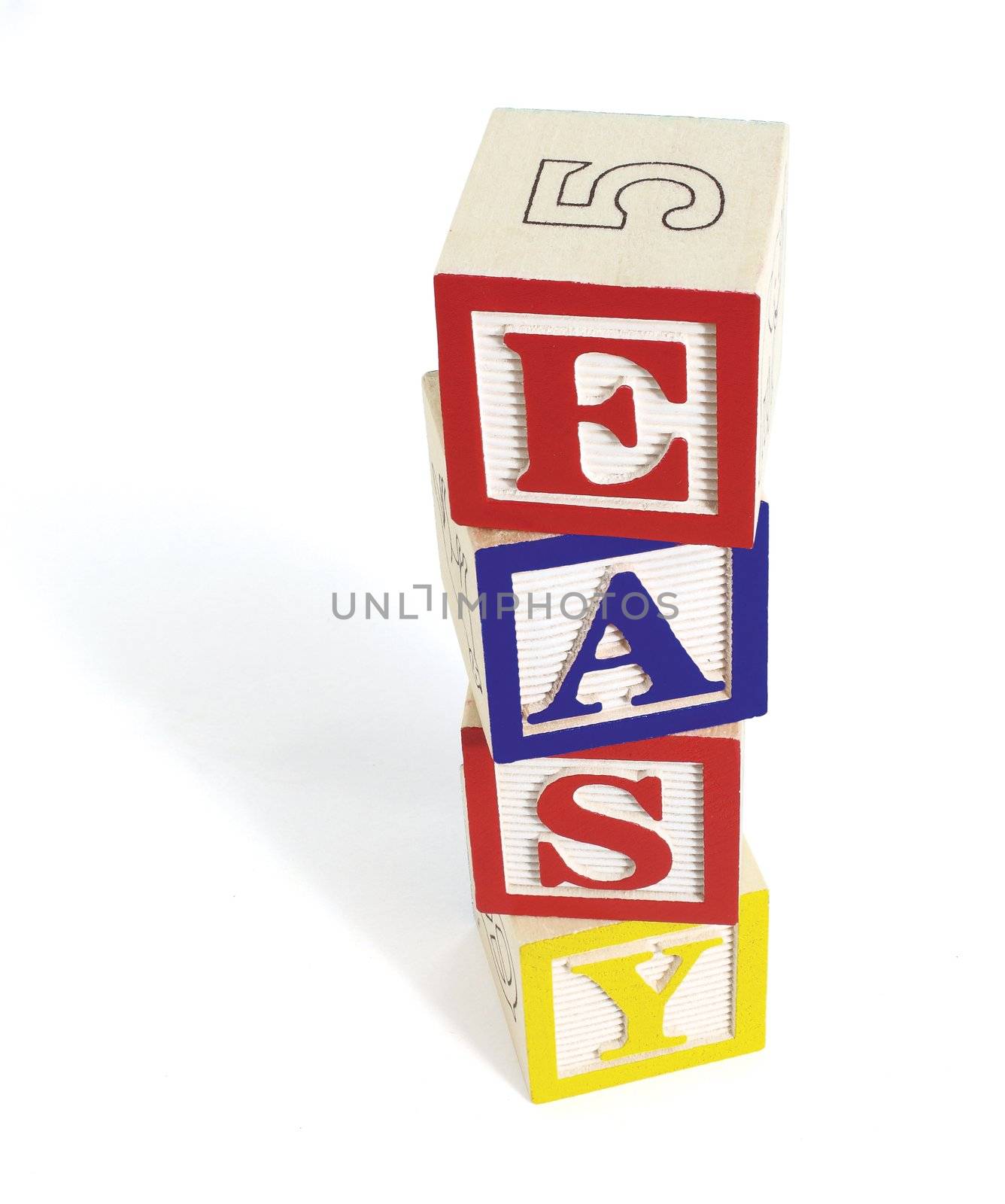 Four wooden alphabet blocks on white background, stacked to form the word, 'easy'. Stack of blocks casts a shadow.