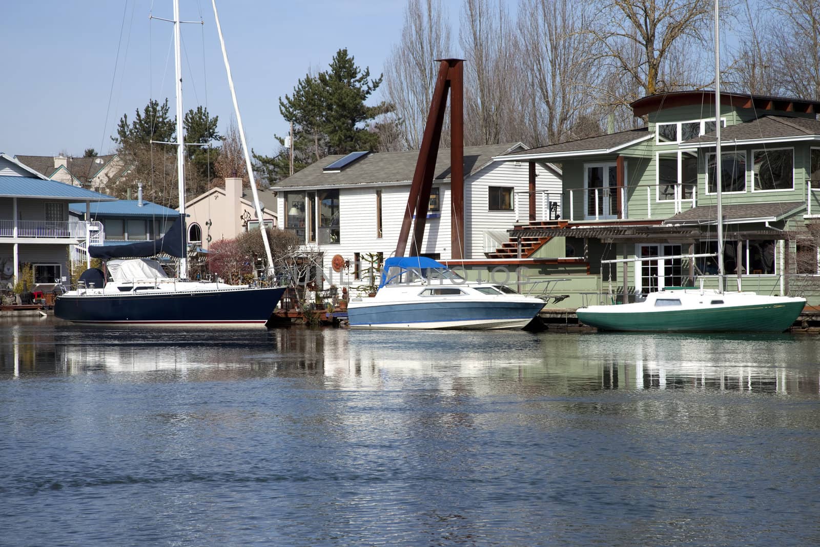 Floating homes and sailboats parked in front, Portland OR.