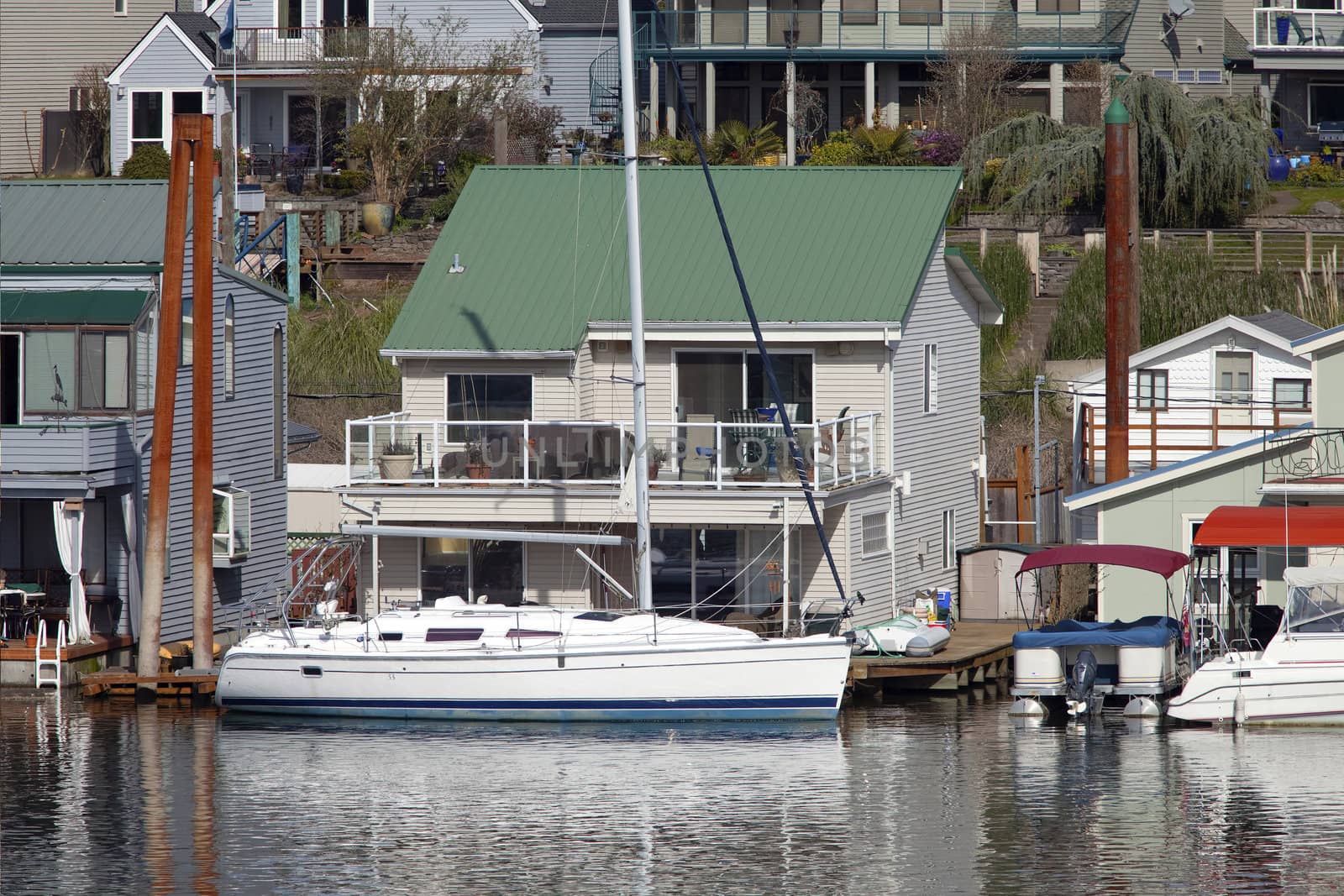 Two level floating house and a power boat, Portland OR.