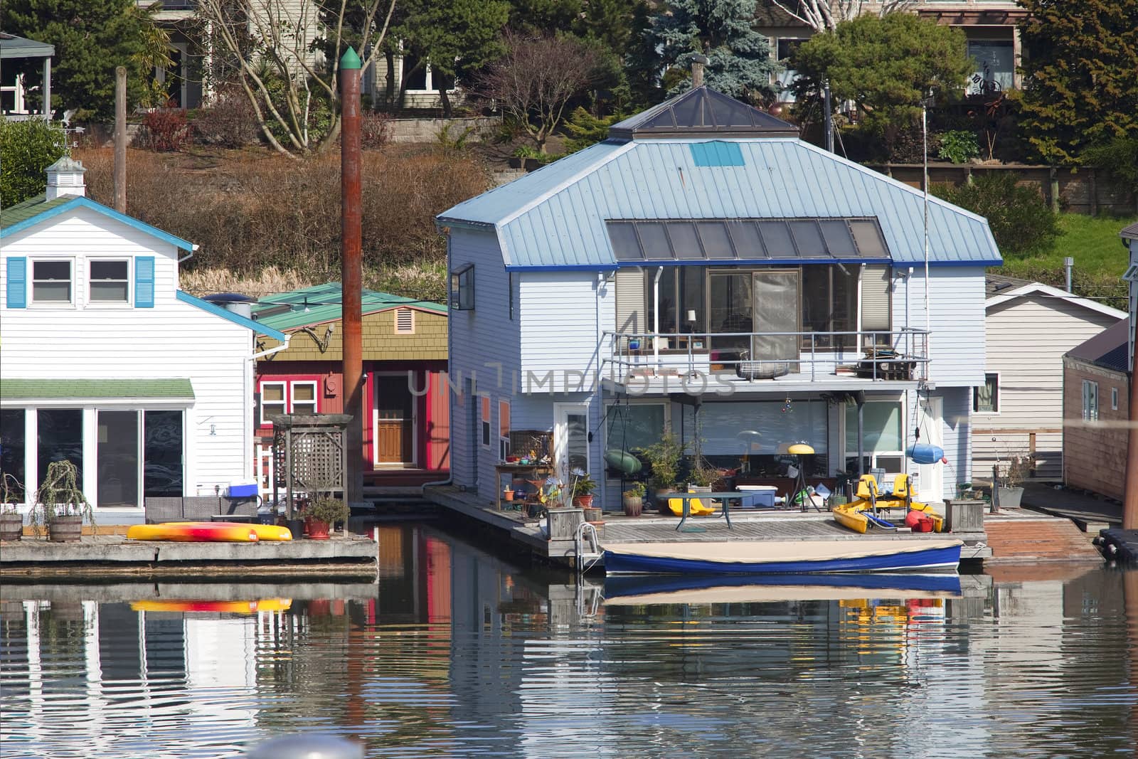 Two level floating house and a power boat, Portland OR.