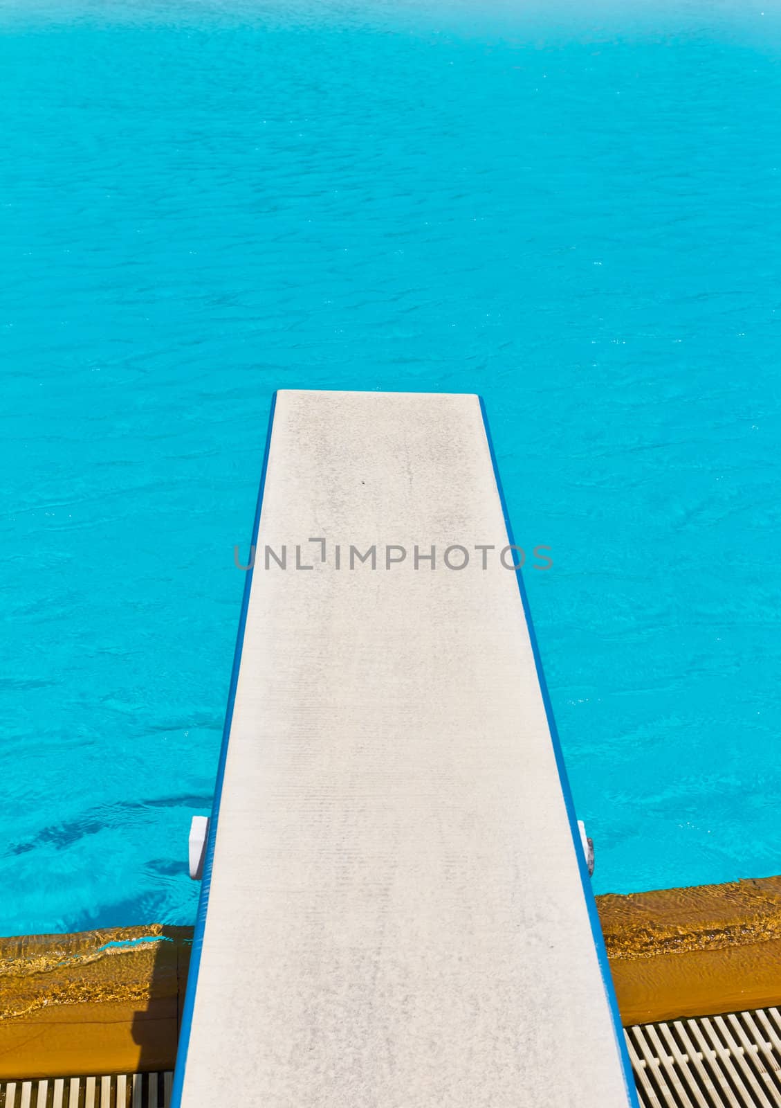 springboard on swimming pool by tungphoto