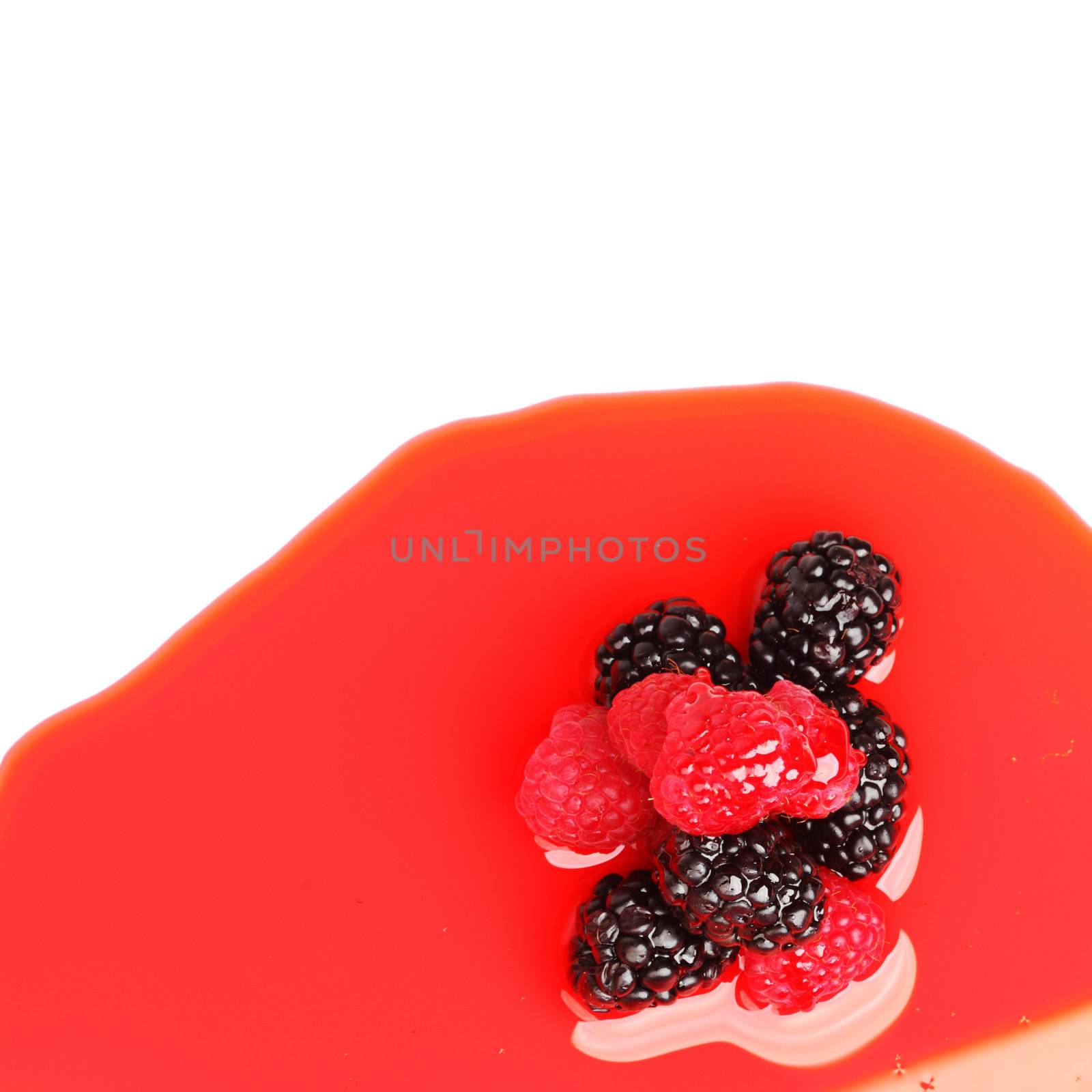 berry mixed pile in syrup isolated on white