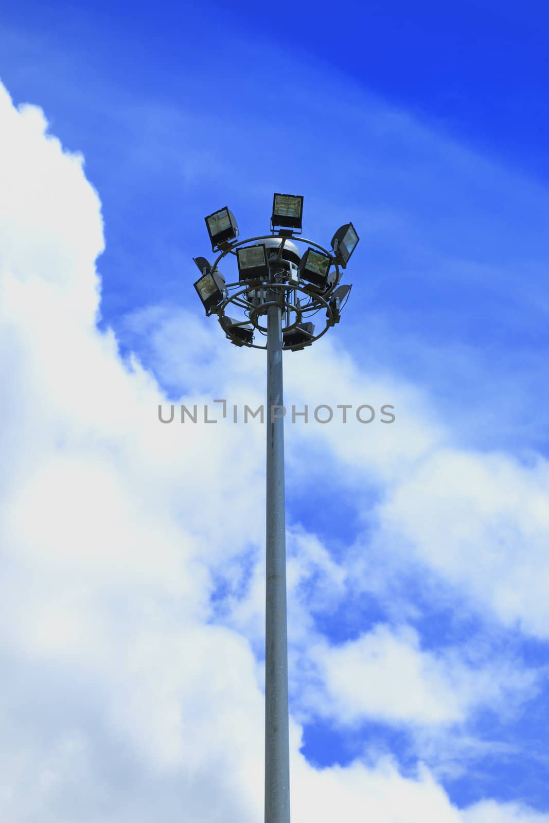 Spotlight steel poles in stadium and blue sky