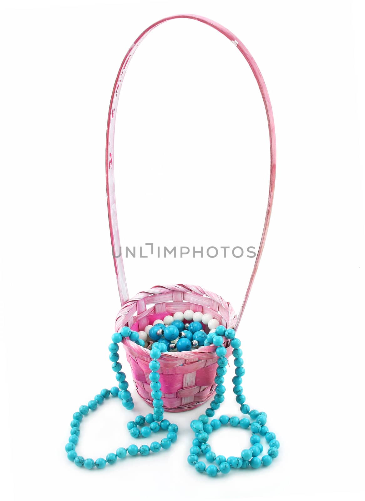 Colored Pearl Beads in Pink Wicker Basket Isolated by alphacell