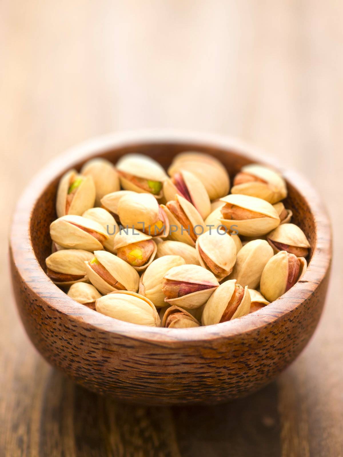 close up of a bowl of pistachio nuts