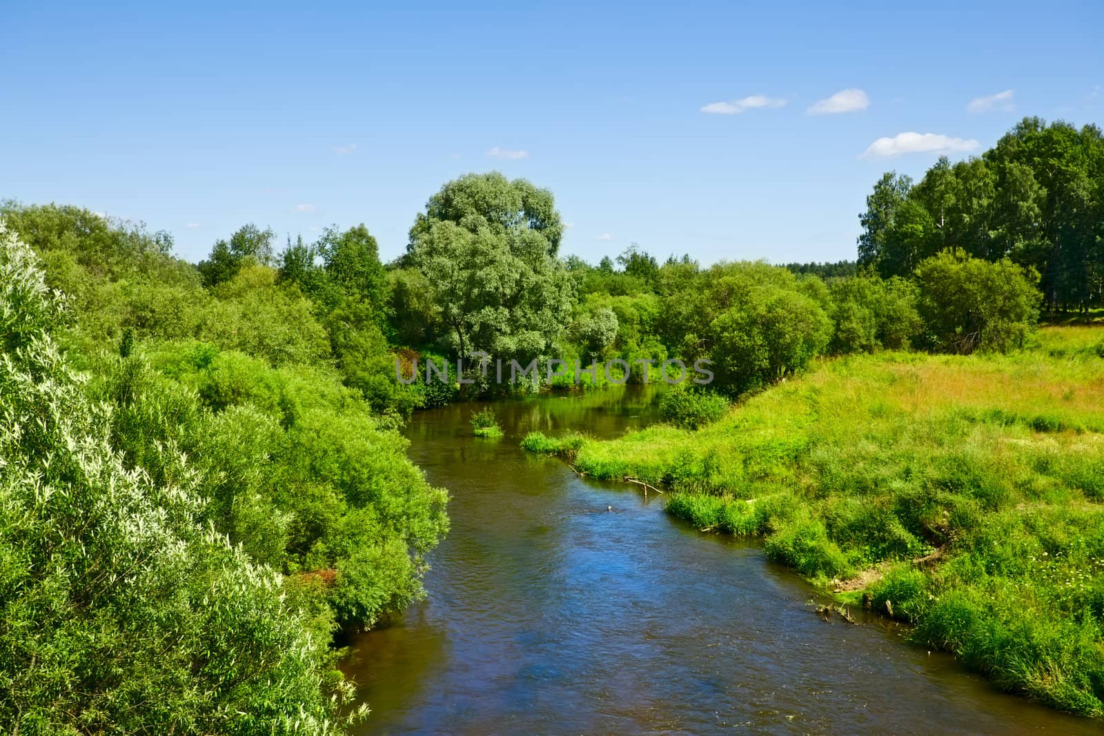 spring landscape with calm river at sunny day