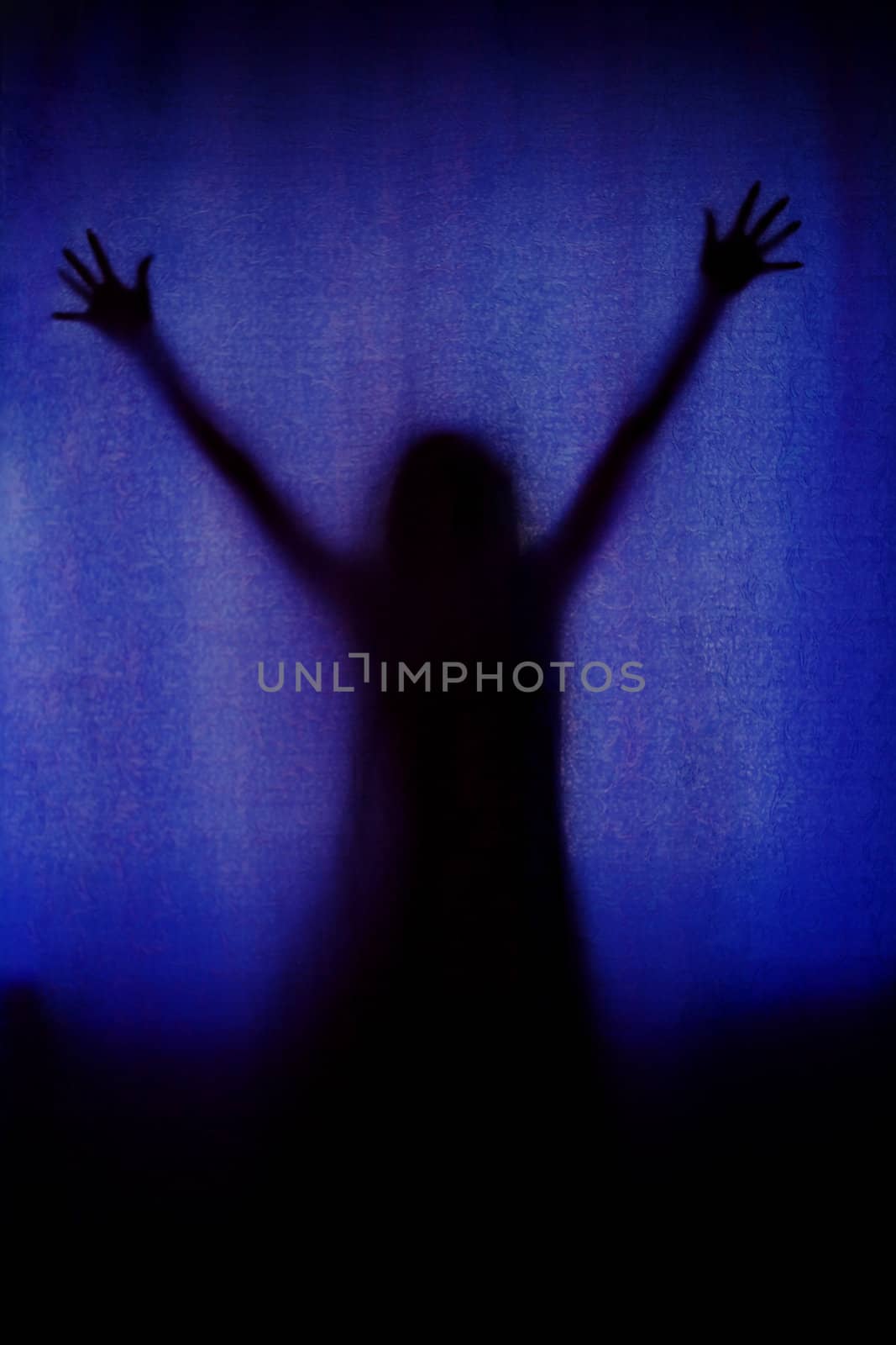 ghost woman black silhouette behind blue curtain