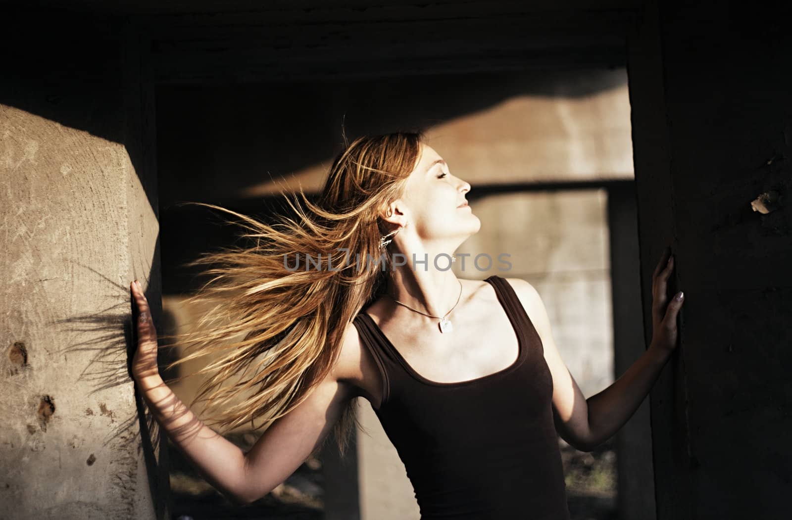beautiful girl with hair fluttering in the wind