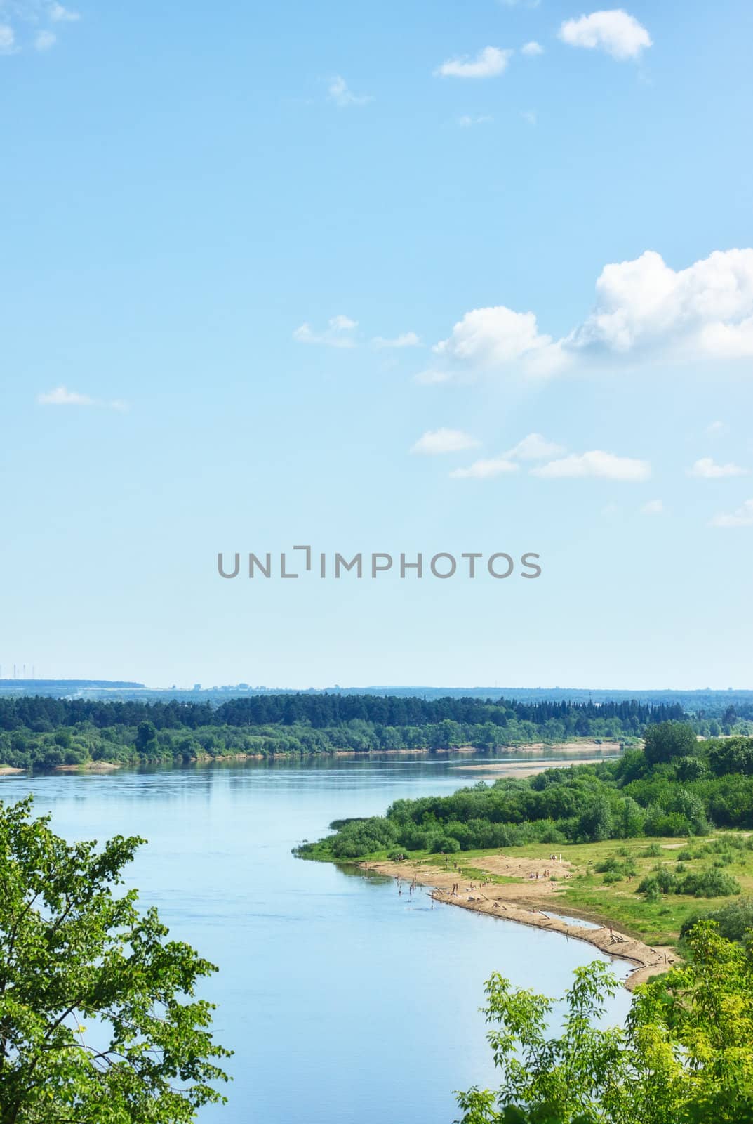 calm river under blue sky at summer day