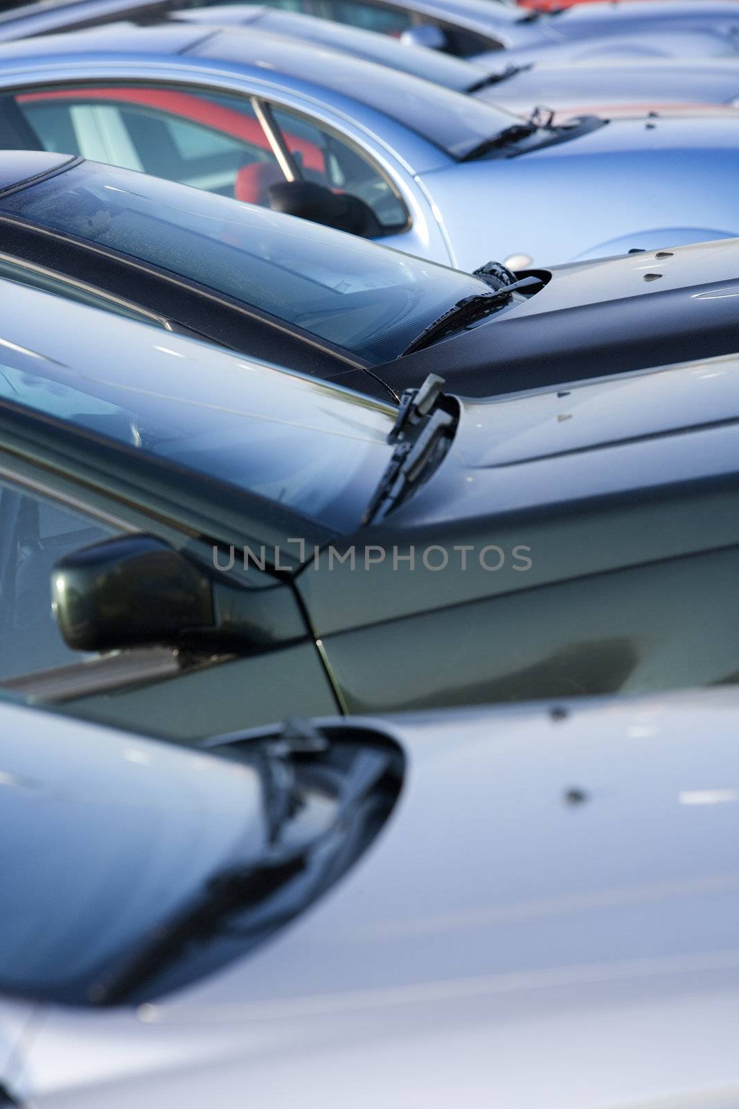 Large group of Parked Cars in a row