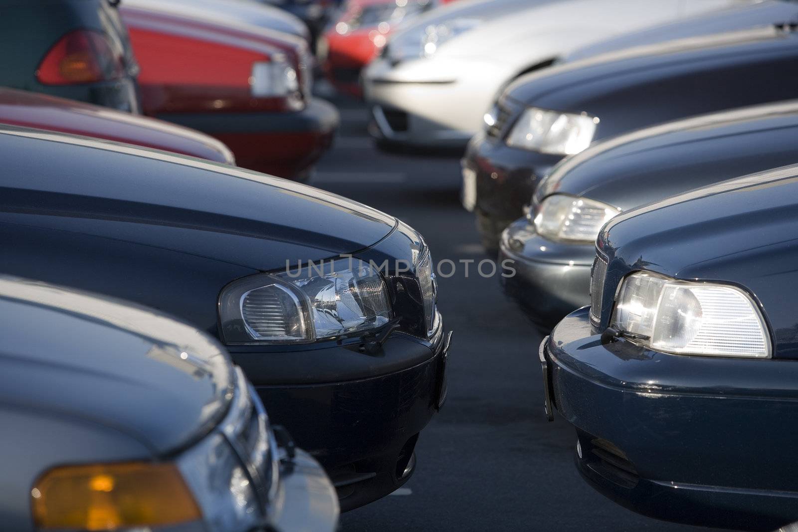 Large group of Parked Cars in a row