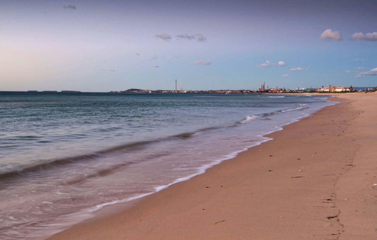 the peaceful beach at wollongong at sunrise