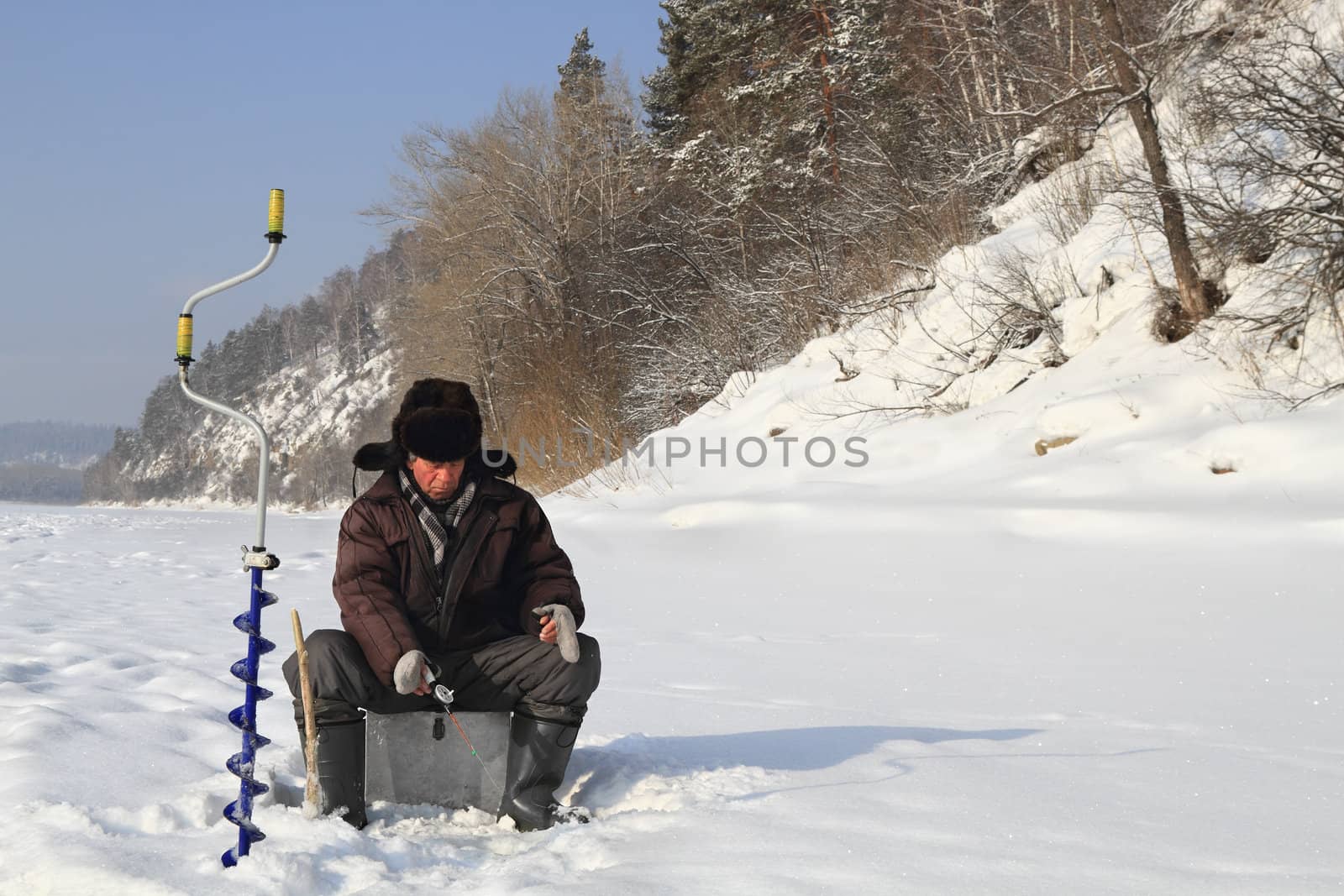 The fisherman on winter fishing