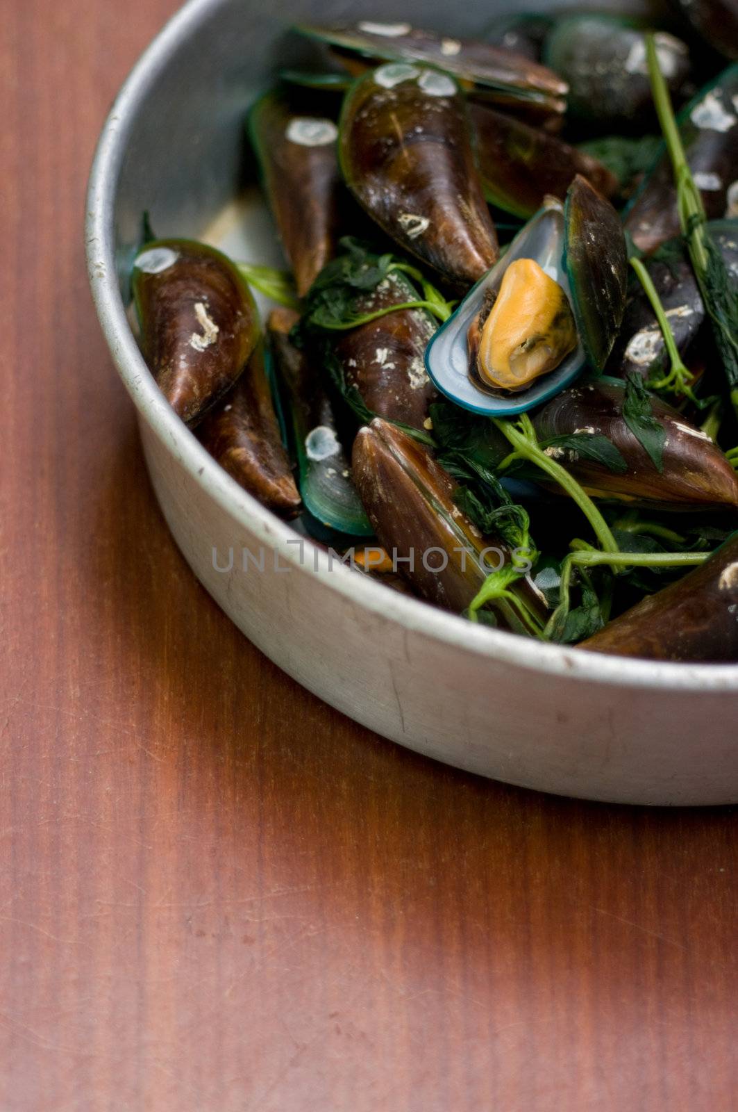 Boiled Asian green mussel on wooden table