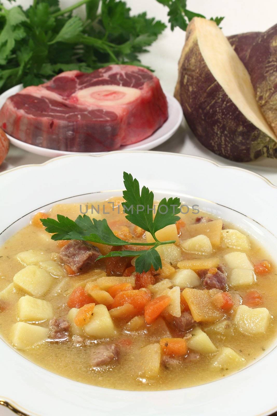 cooked Turnip soup with beef, fresh carrots, potatoes and parsley