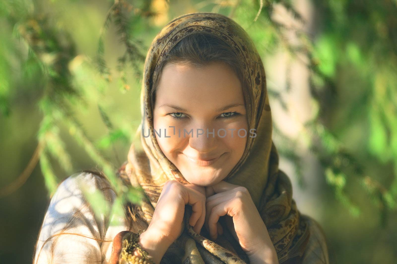 beautiful russian peasant girl in spruce forest