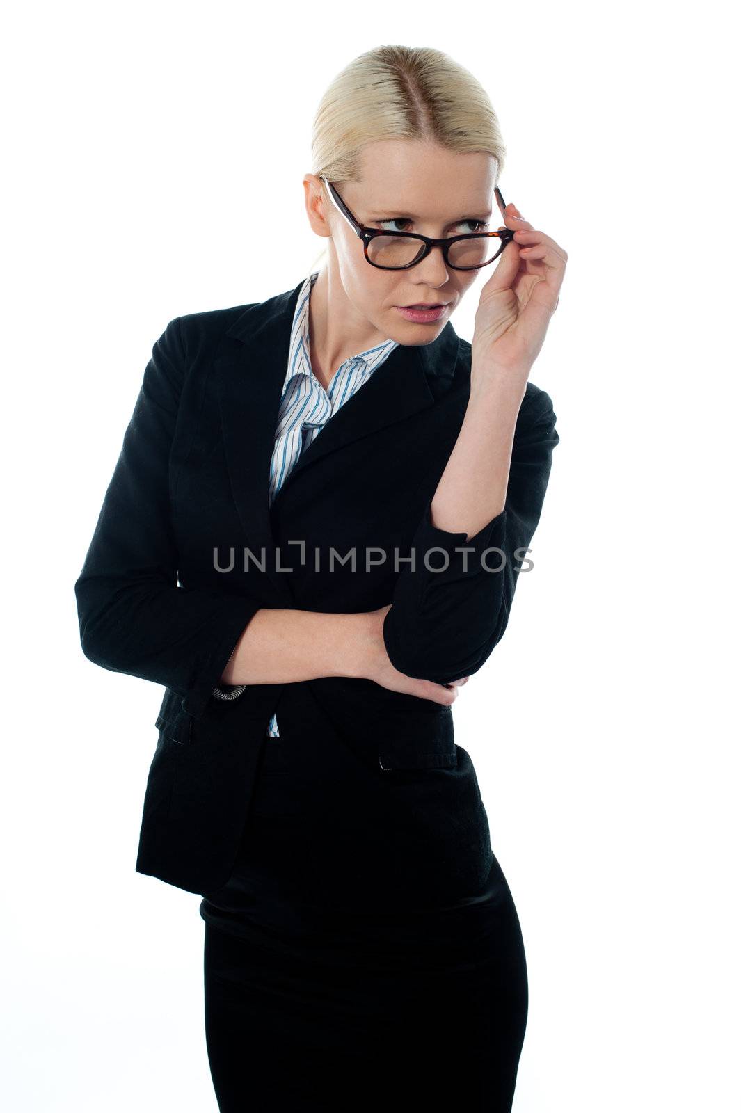 Full view of attractive businesswoman looking away by stockyimages
